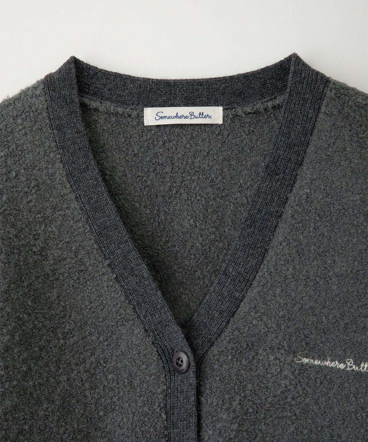 썸웨어버터(SOMEWHEREBUTTER) Rima Boucle V-Neck Cardigan - Charcoal