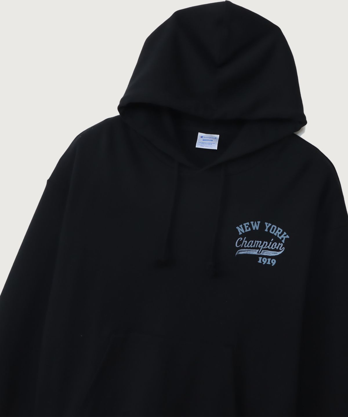 챔피온(CHAMPION) 여성 NEW YORK 루즈핏 후드 티셔츠 Black
