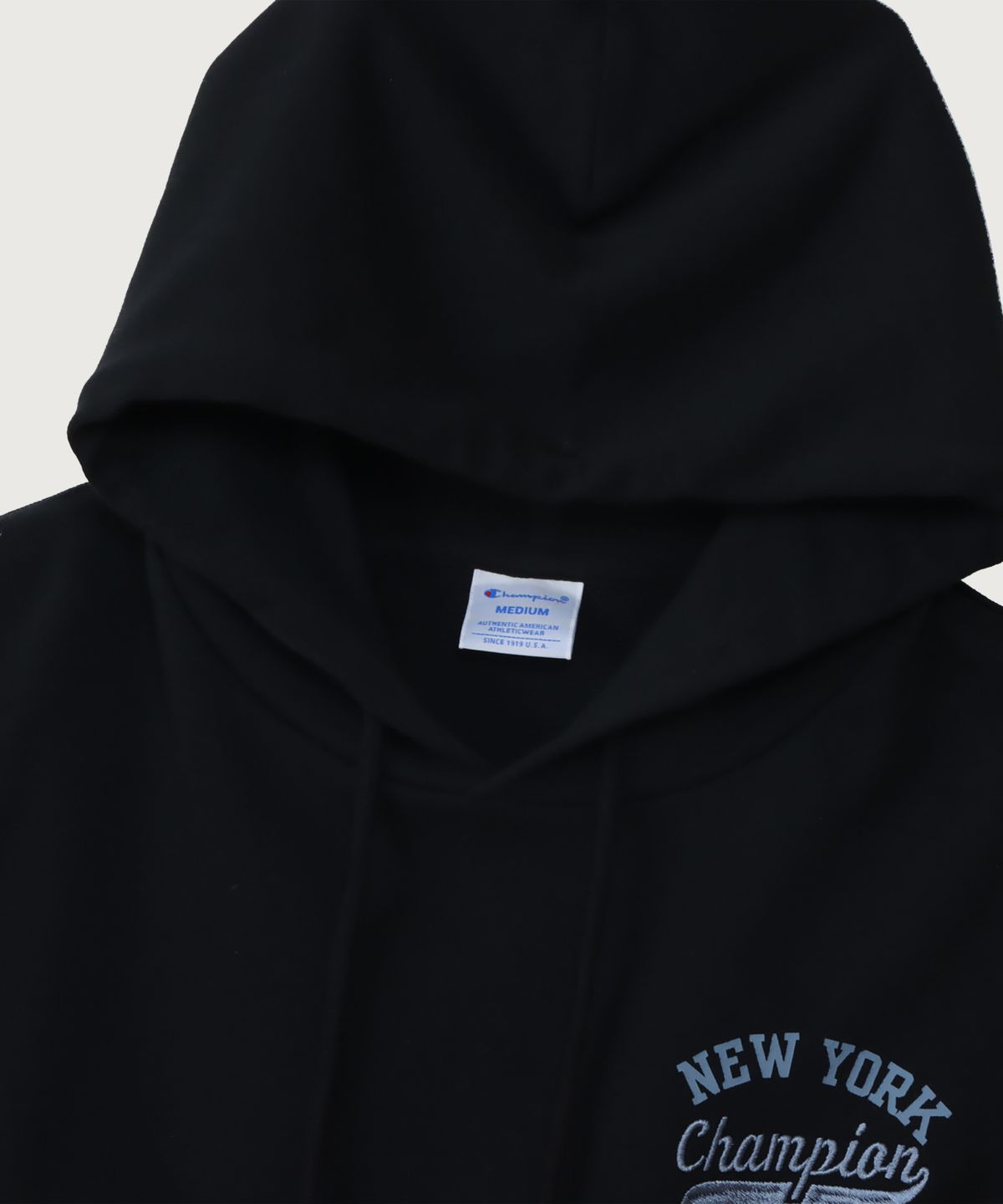 챔피온(CHAMPION) 여성 NEW YORK 루즈핏 후드 티셔츠 Black