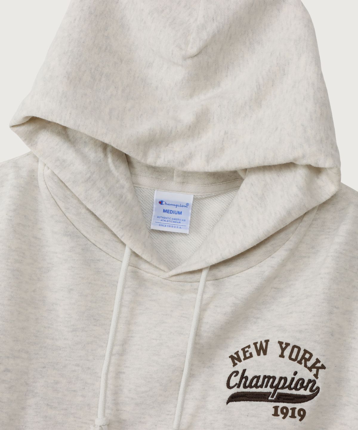 챔피온(CHAMPION) 여성 NEW YORK 루즈핏 후드 티셔츠 Oatmeal