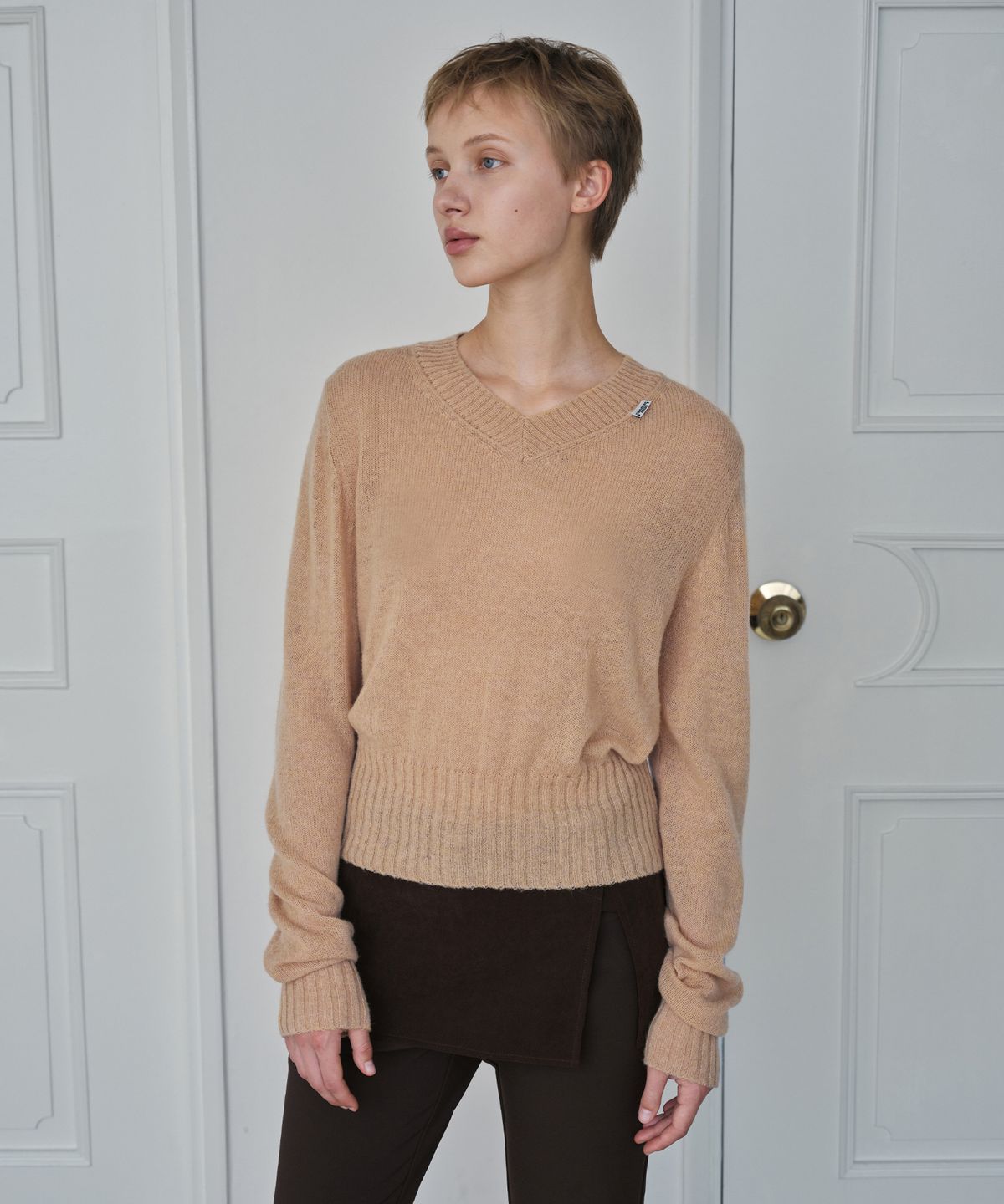 시메트릭 퍼센트(SYMMETRICPERCENT) Baby Logo Knit Top / Peach Beige
