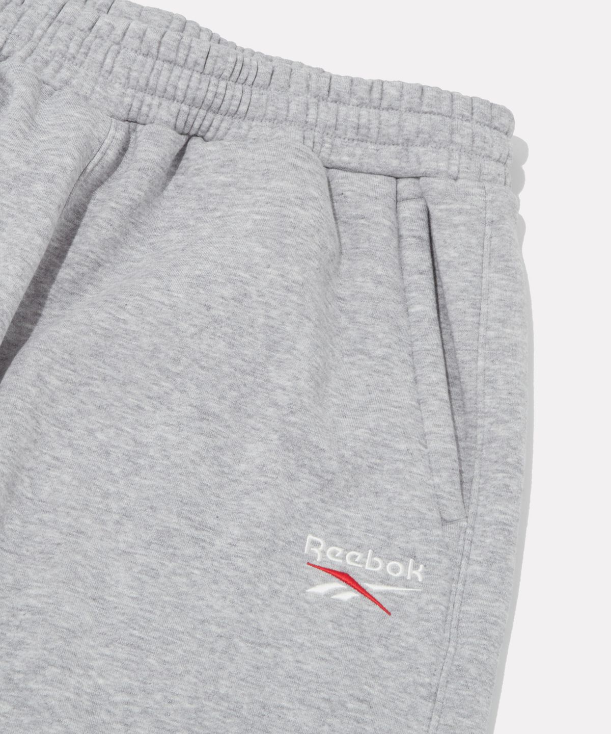리복(REEBOK) 와이드핏 기모 스웻팬츠 - 멜란지 그레이
