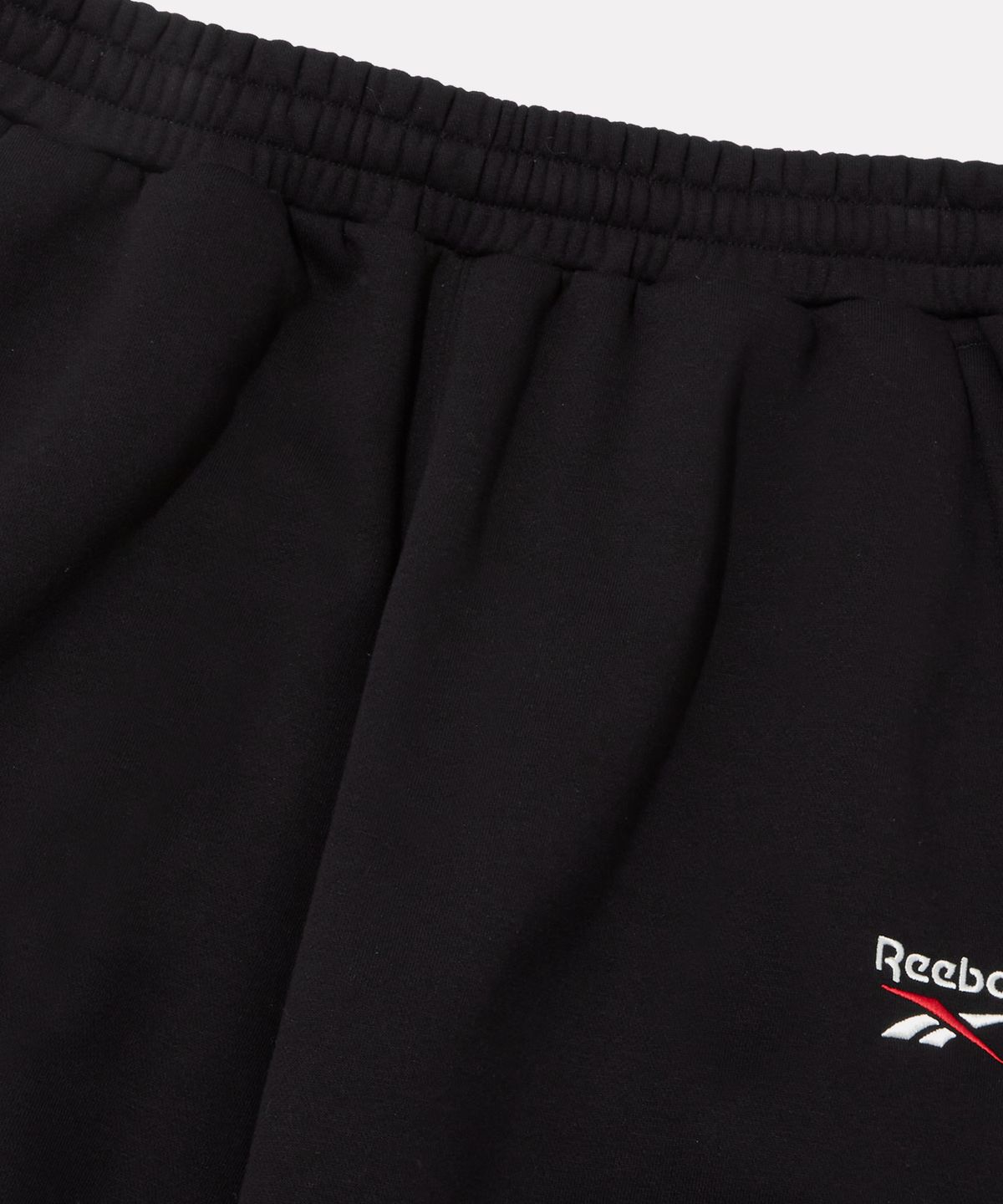 리복(REEBOK) 와이드핏 기모 스웻팬츠 - 블랙