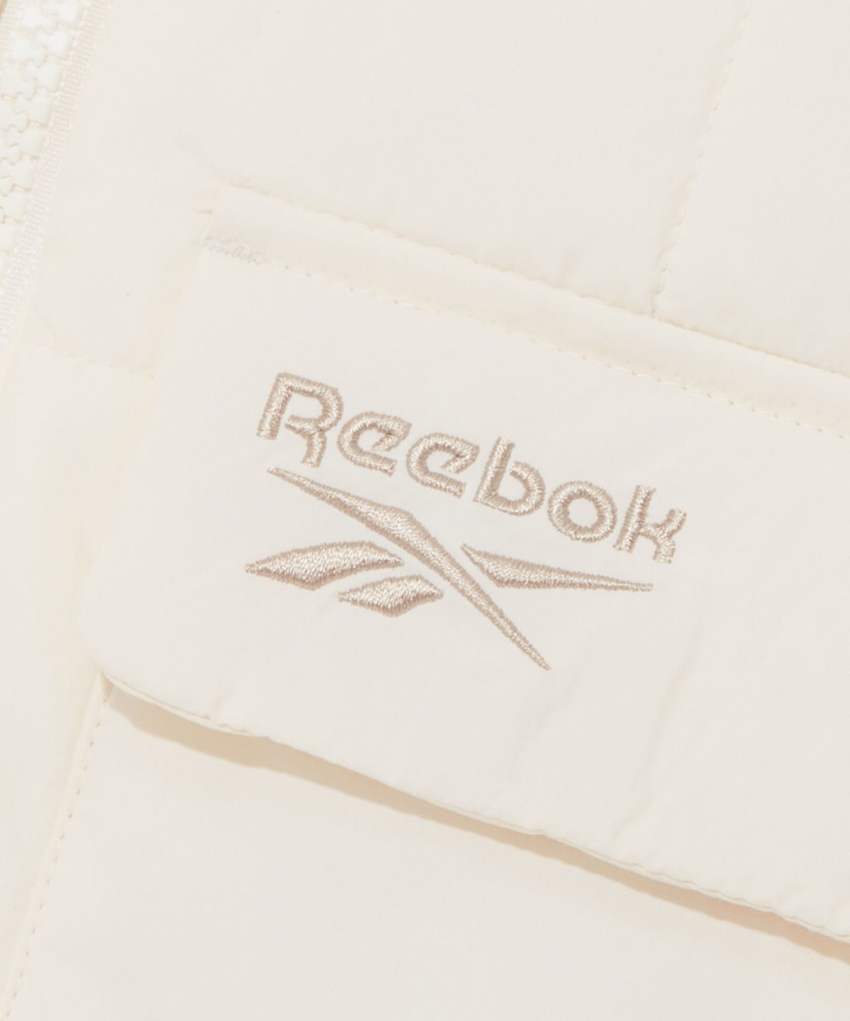 리복(REEBOK) 스퀘어 퀼팅 패딩 자켓 (W) - 아이보리