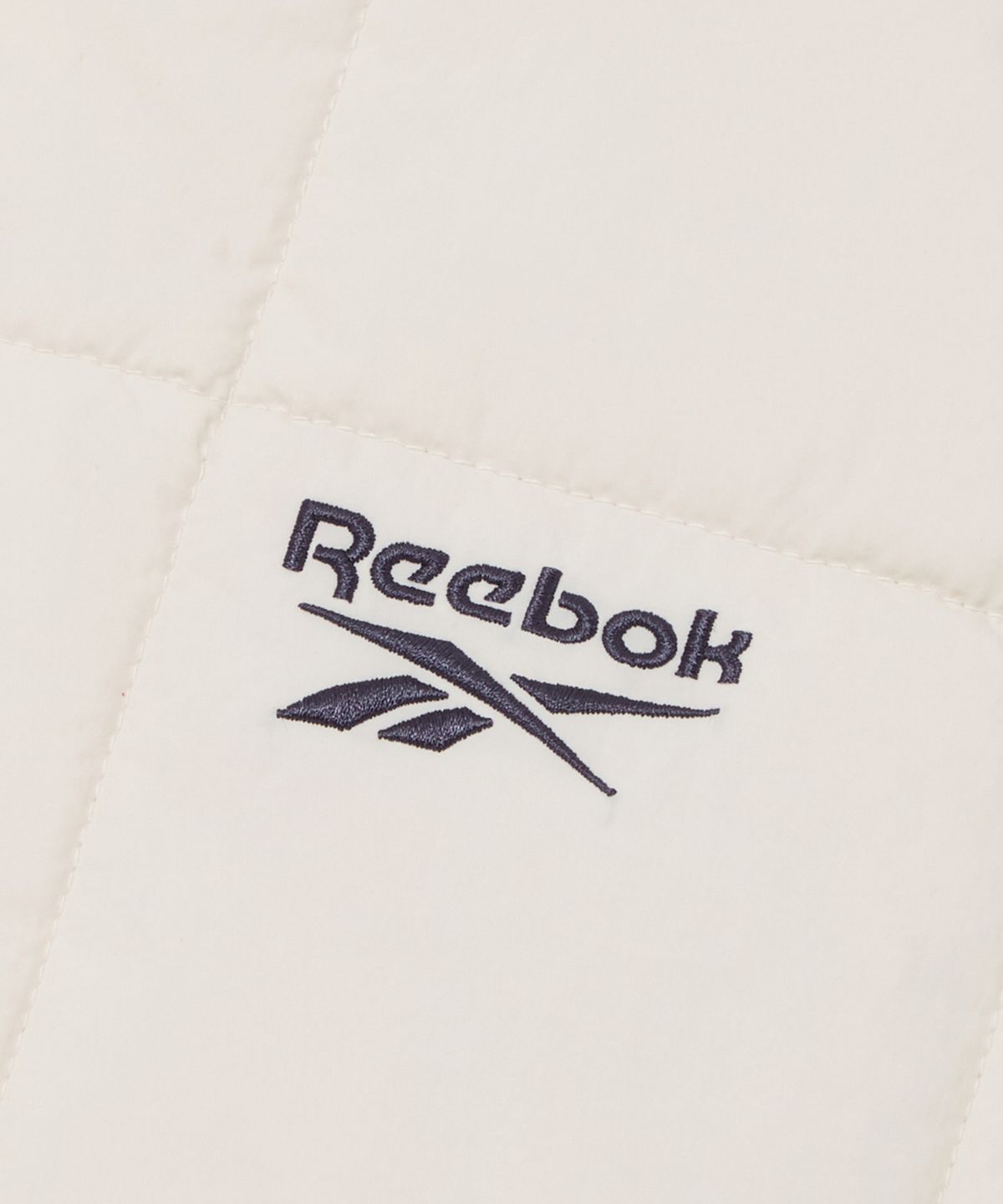 리복(REEBOK) 스퀘어 퀼팅 패딩 자켓 - 아이보리