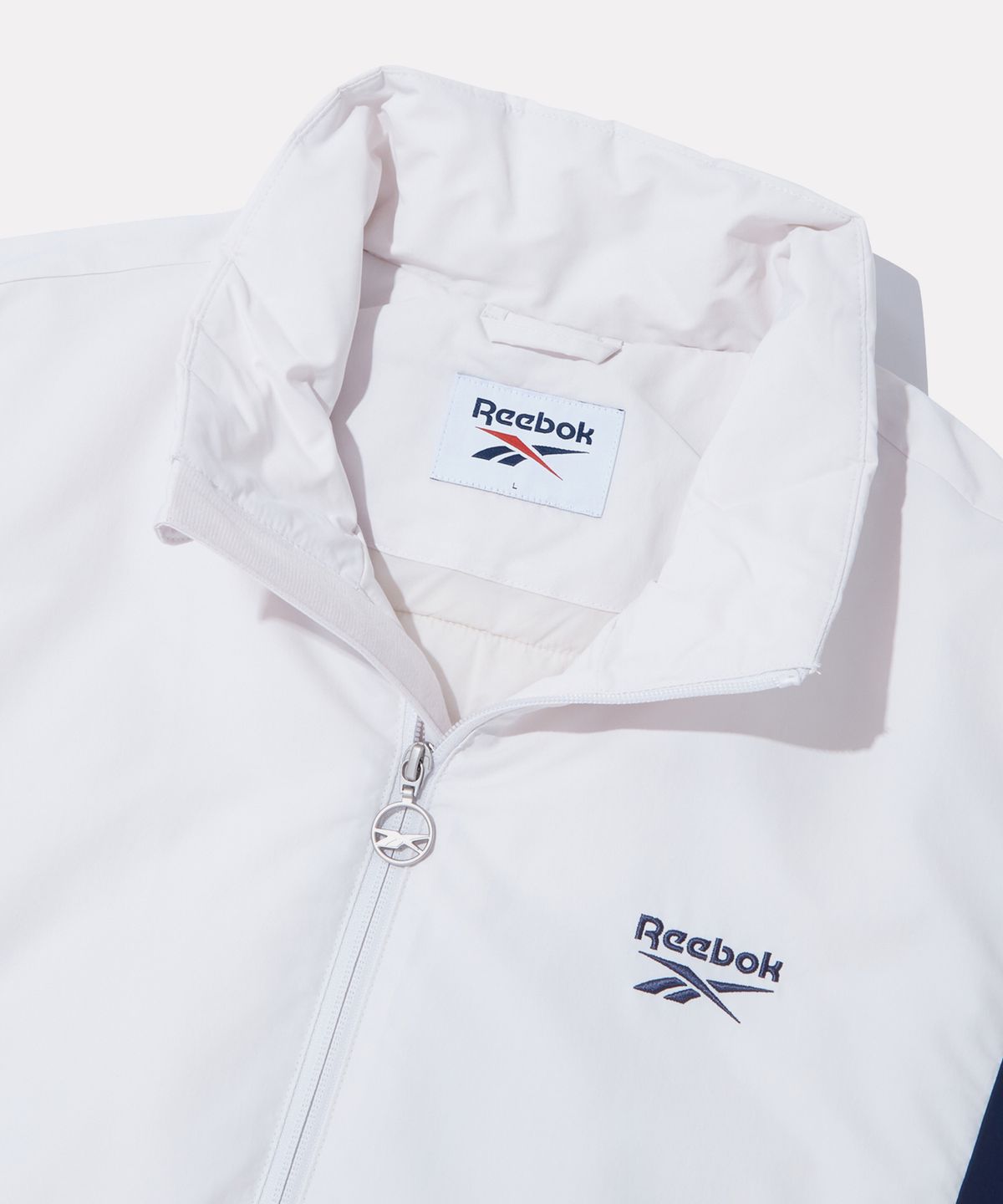 리복(REEBOK) 헤리티지 경량패딩 - 크림