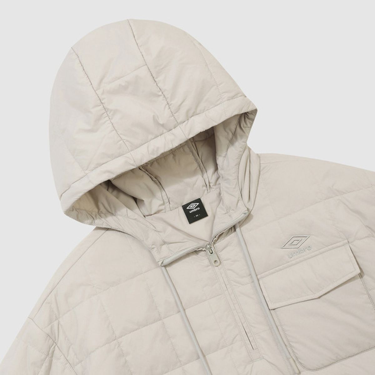 엄브로(UMBRO) 멜로우 퀼티드 패딩 후드아노락 베이지 UQ423CWTO1