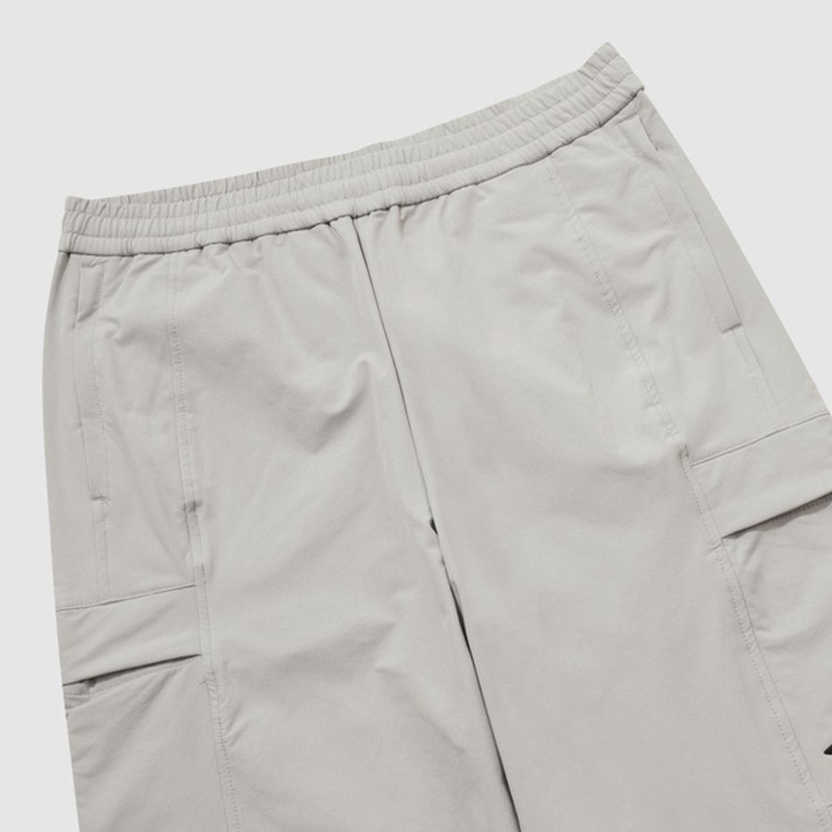 엄브로(UMBRO) 폴라 스트레치 기모 카고 스트레이트 & 조거 2WAY 팬츠 베이지 UQ421SPTO2