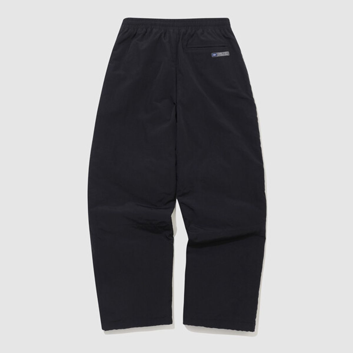 엄브로(UMBRO) 유니온 트랙 와이드 & 조거 2WAY 패딩 우븐 팬츠 블랙 UQ321CPT94