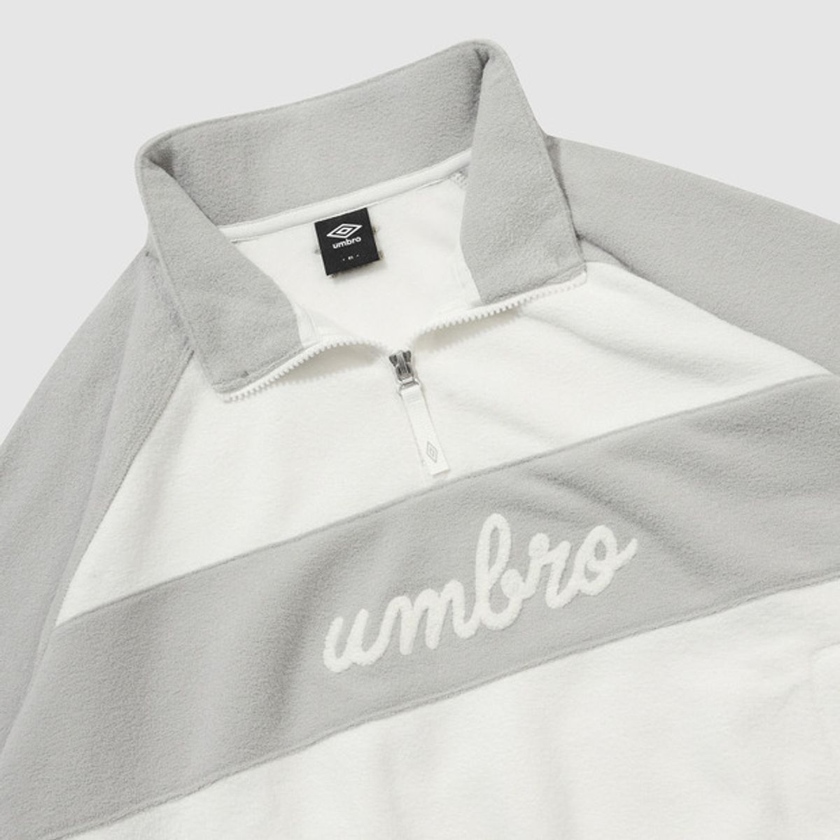 엄브로(UMBRO) 우먼스 플러피 스탠넥 하프집업 맨투맨 아이보리 UQ422CFSN1
