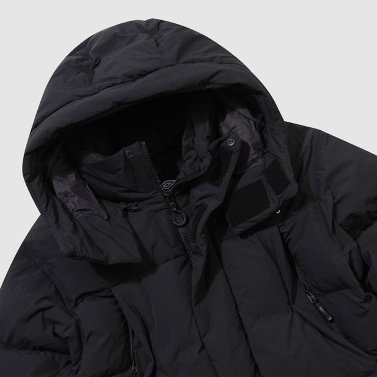 엄브로(UMBRO) 윈터 헤븐 면터치 유틸리티 머스코비 덕 다운 자켓 블랙 UQ421CDJN2