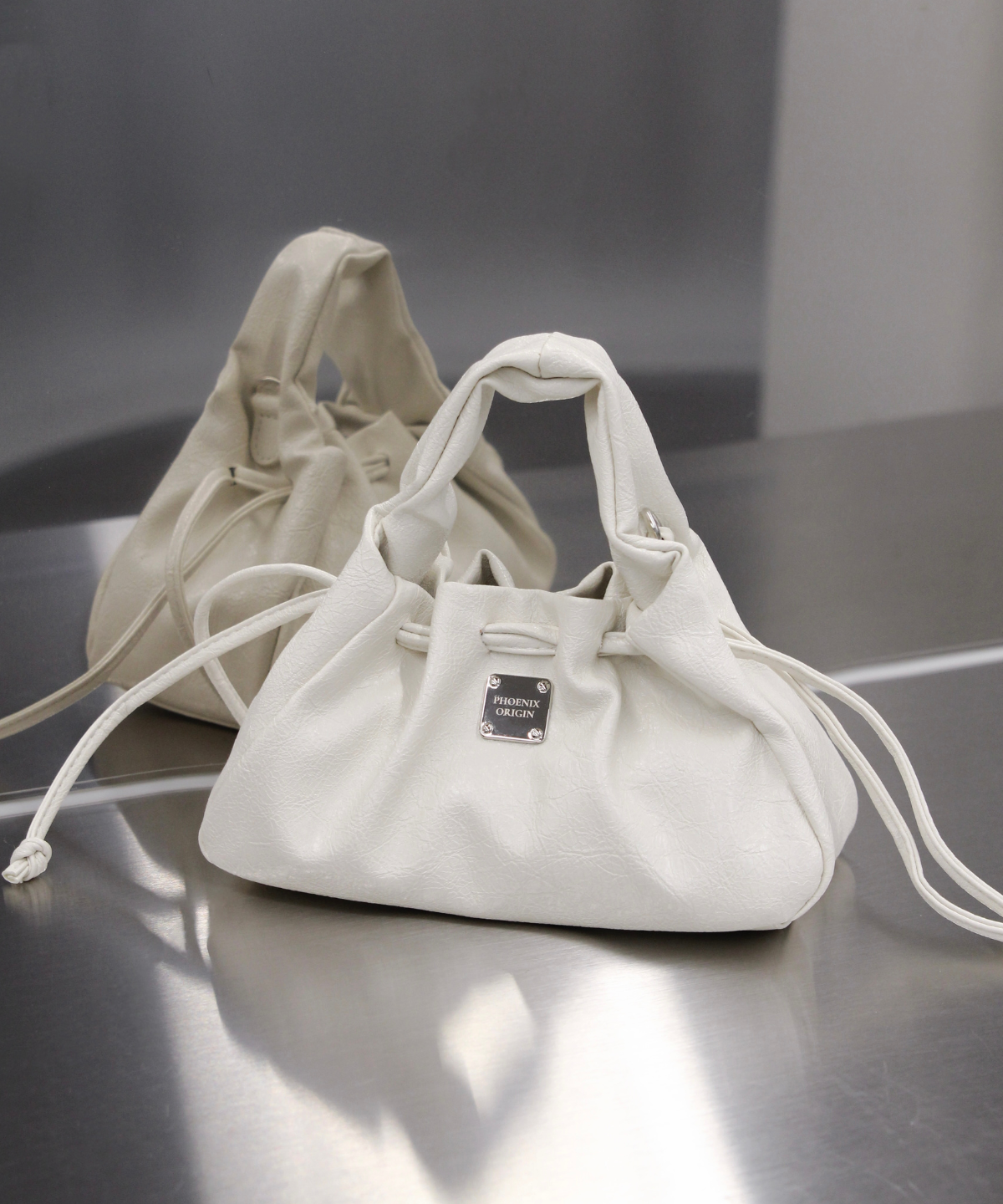 피닉스오리진(PHOENIX ORIGIN) Mini Dumpling Bag - White