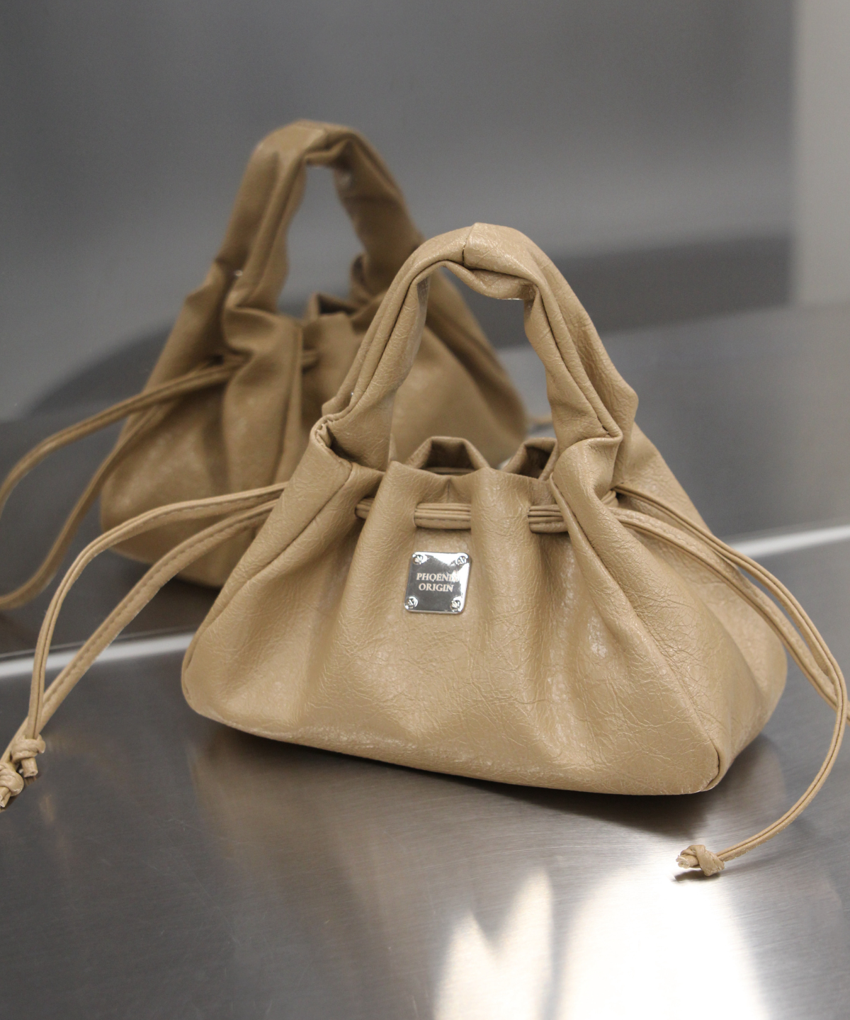 피닉스오리진(PHOENIX ORIGIN) Mini Dumpling Bag - Khaki