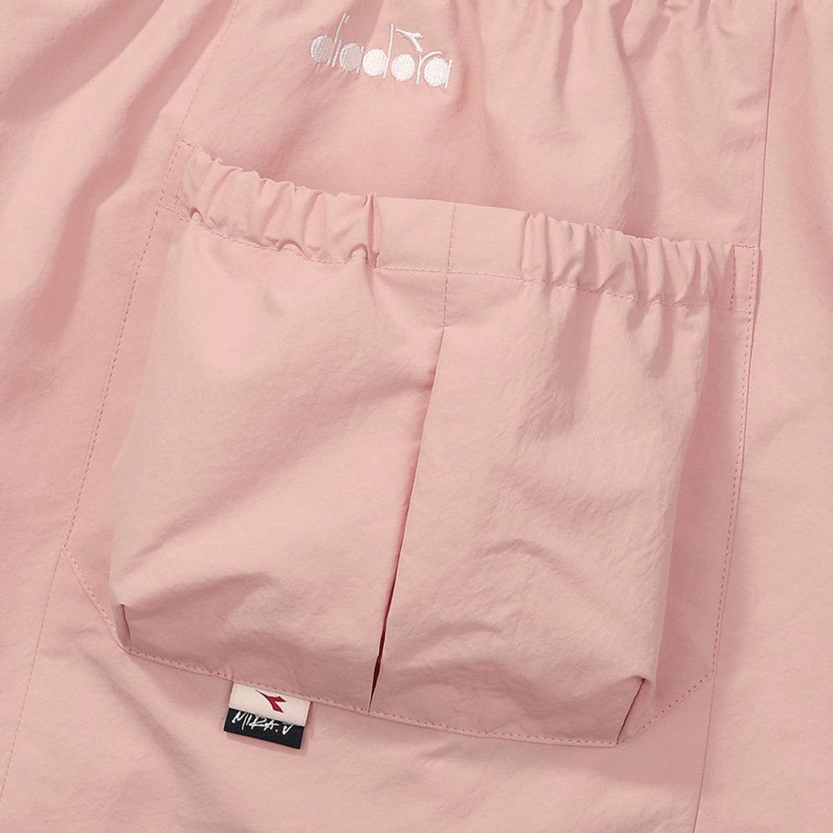 디아도라(diadora) 크로스코트 우븐 쇼츠 우먼 CORAL