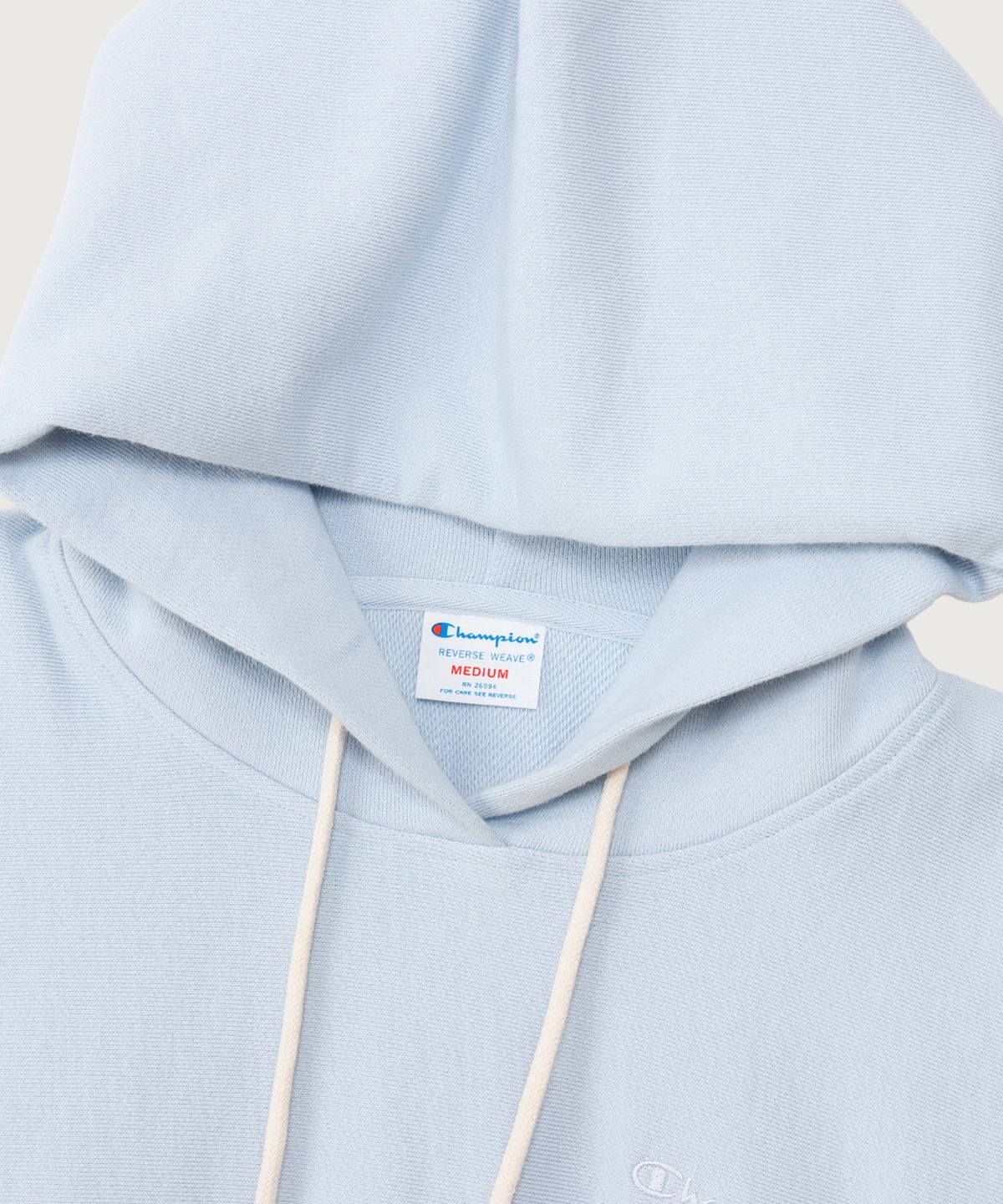 챔피온(CHAMPION) 여성 리버스위브 스몰 로고 루즈핏 후드 티셔츠 Light Blue