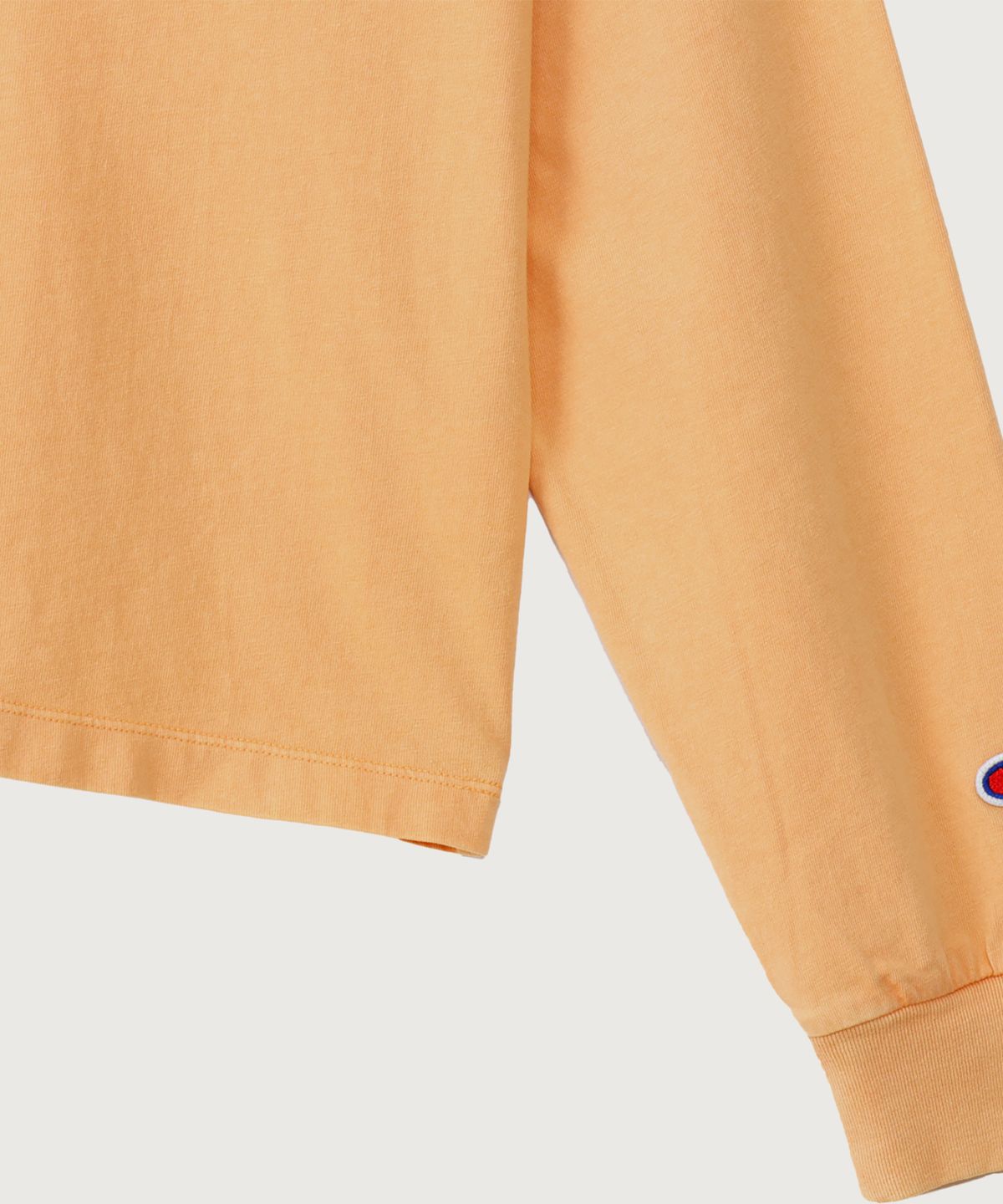 챔피온(CHAMPION) 여성 아치 로고 루즈핏 워싱 롱슬리브 Soft Orange