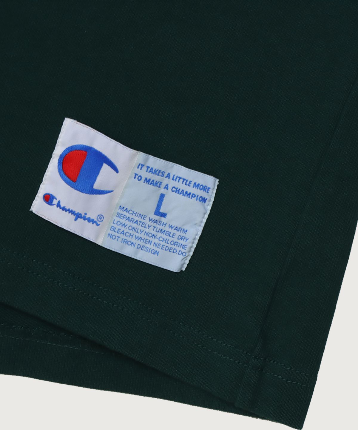 챔피온(CHAMPION) 하프 스냅 오버핏 조그택 롱슬리브 티셔츠 Dark Green