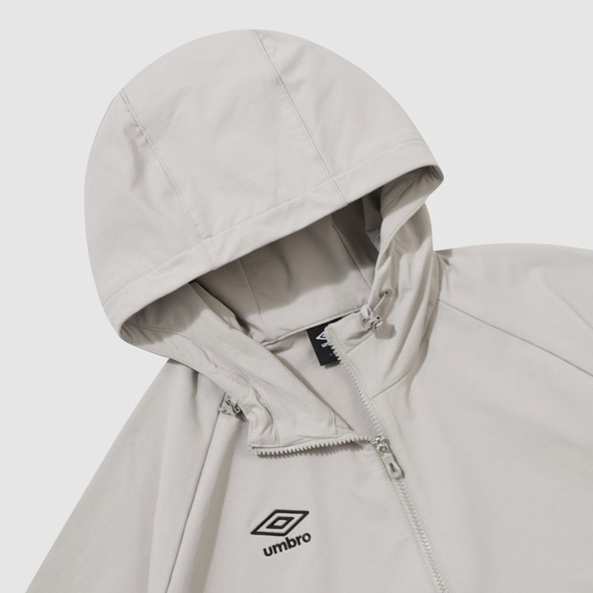 엄브로(UMBRO) 폴라 스트레치 기모 포켓 후드형 아노락 베이지 UQ421SWTO1