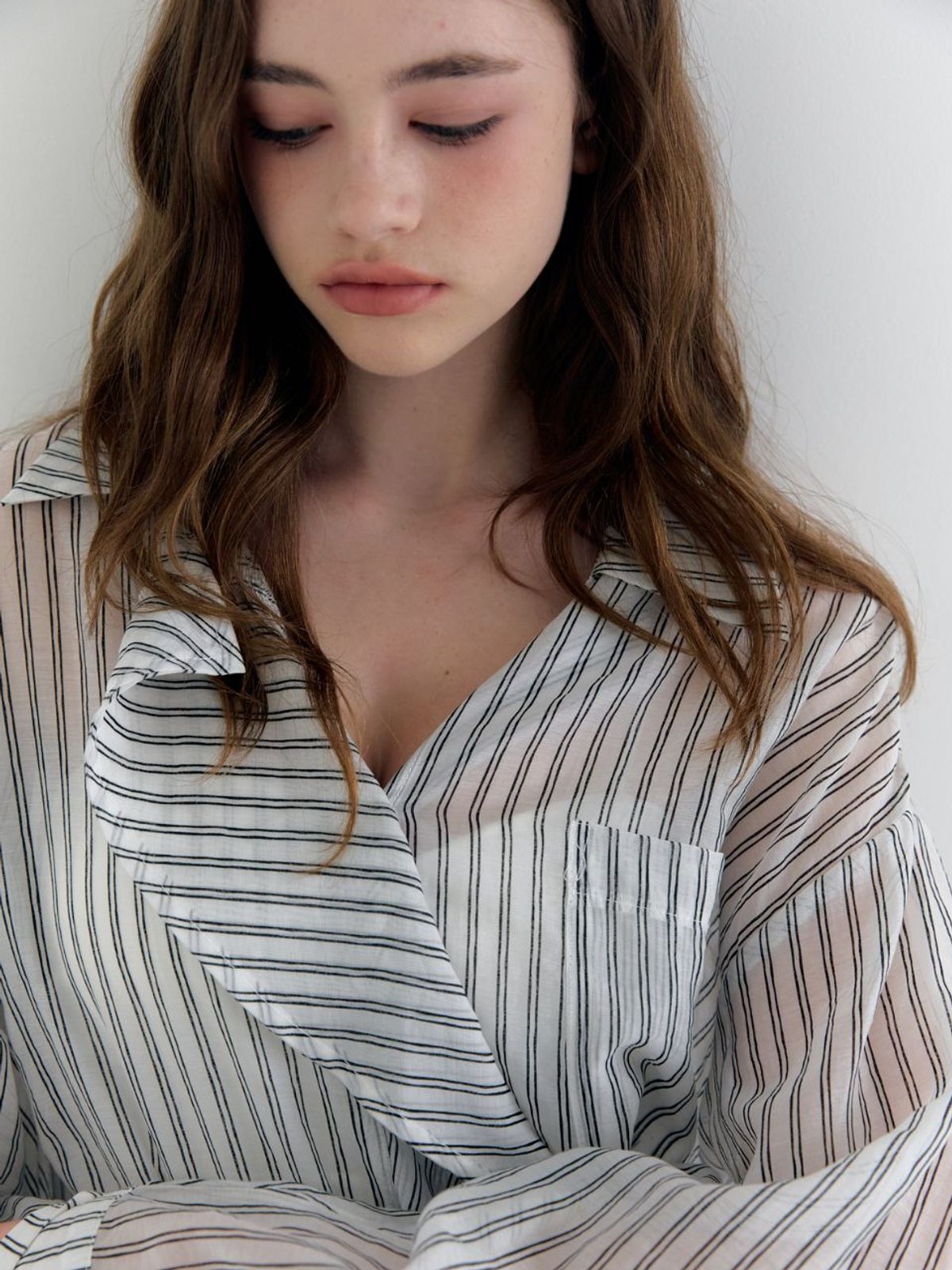 패브릭서울(FABRICSEOUL) see-through oversized stripe ruffle blouse
