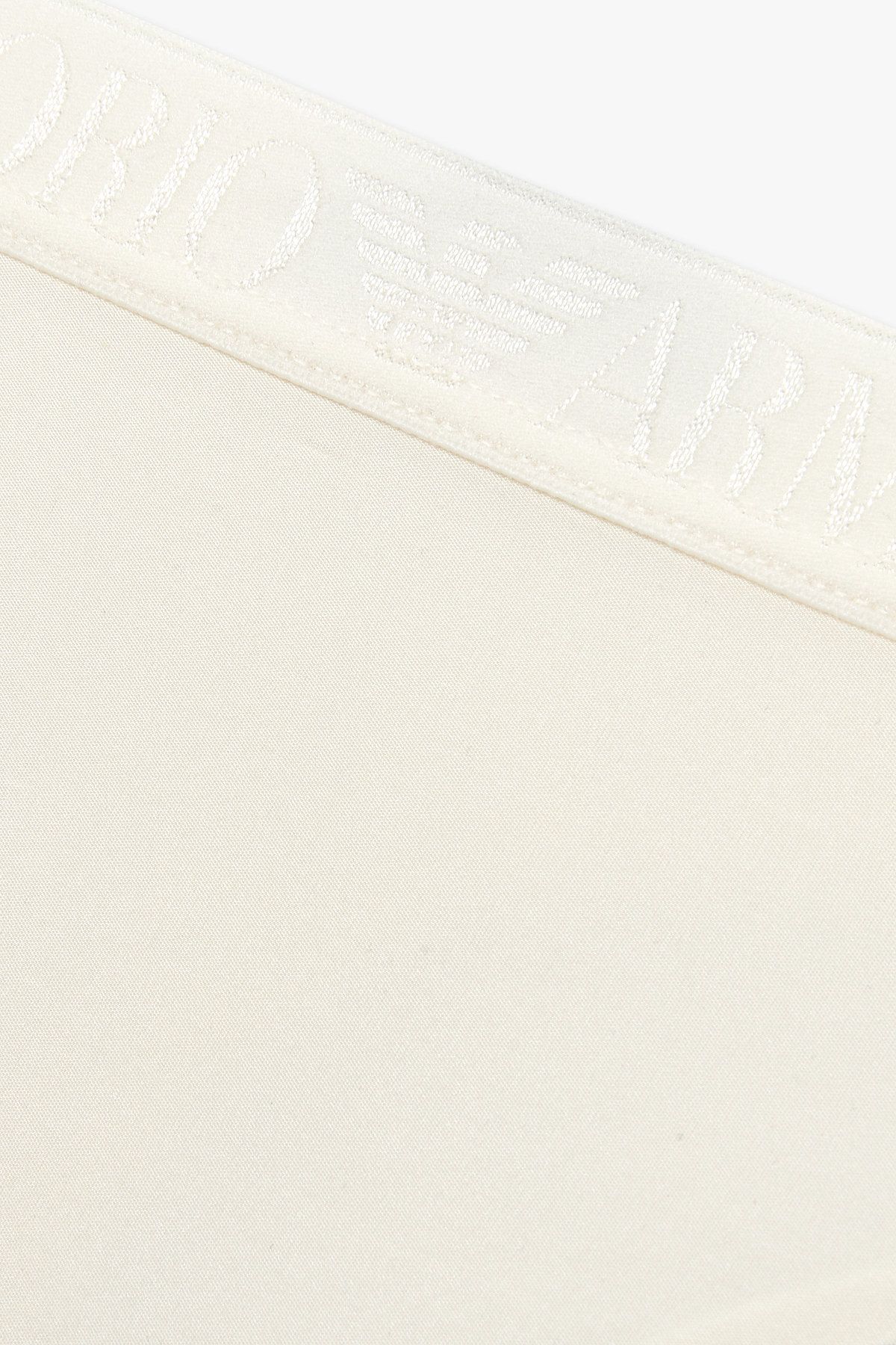 엠포리오 아르마니 언더웨어(EMPORIO ARMANI UNDERWEAR) 여성 샤이닝 로고 밴딩 티팬티_아이보리 0825310508