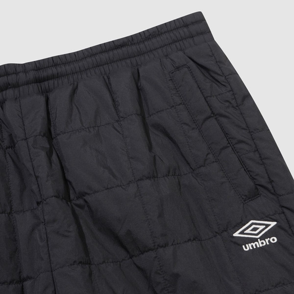 엄브로(UMBRO) 멜로우 퀼티드 패딩 팬츠 블랙 UQ423CPTO2