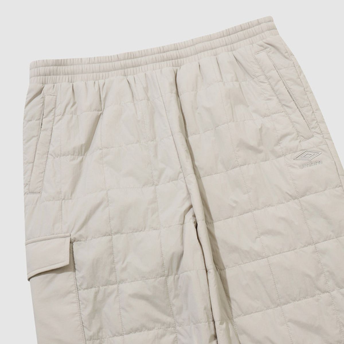 엄브로(UMBRO) 멜로우 퀼티드 패딩 팬츠 아이보리 UQ423CPTO2