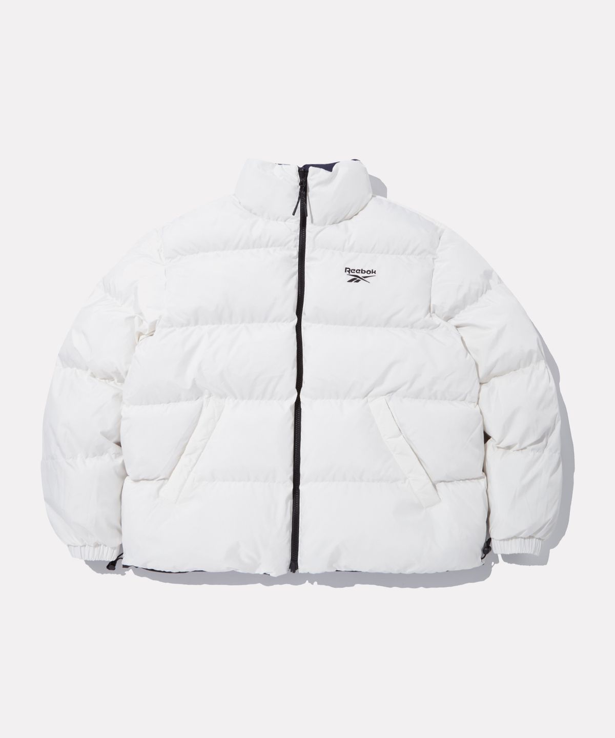 리복(REEBOK) 벡터 리버시블 볼패딩 - 네이비:화이트