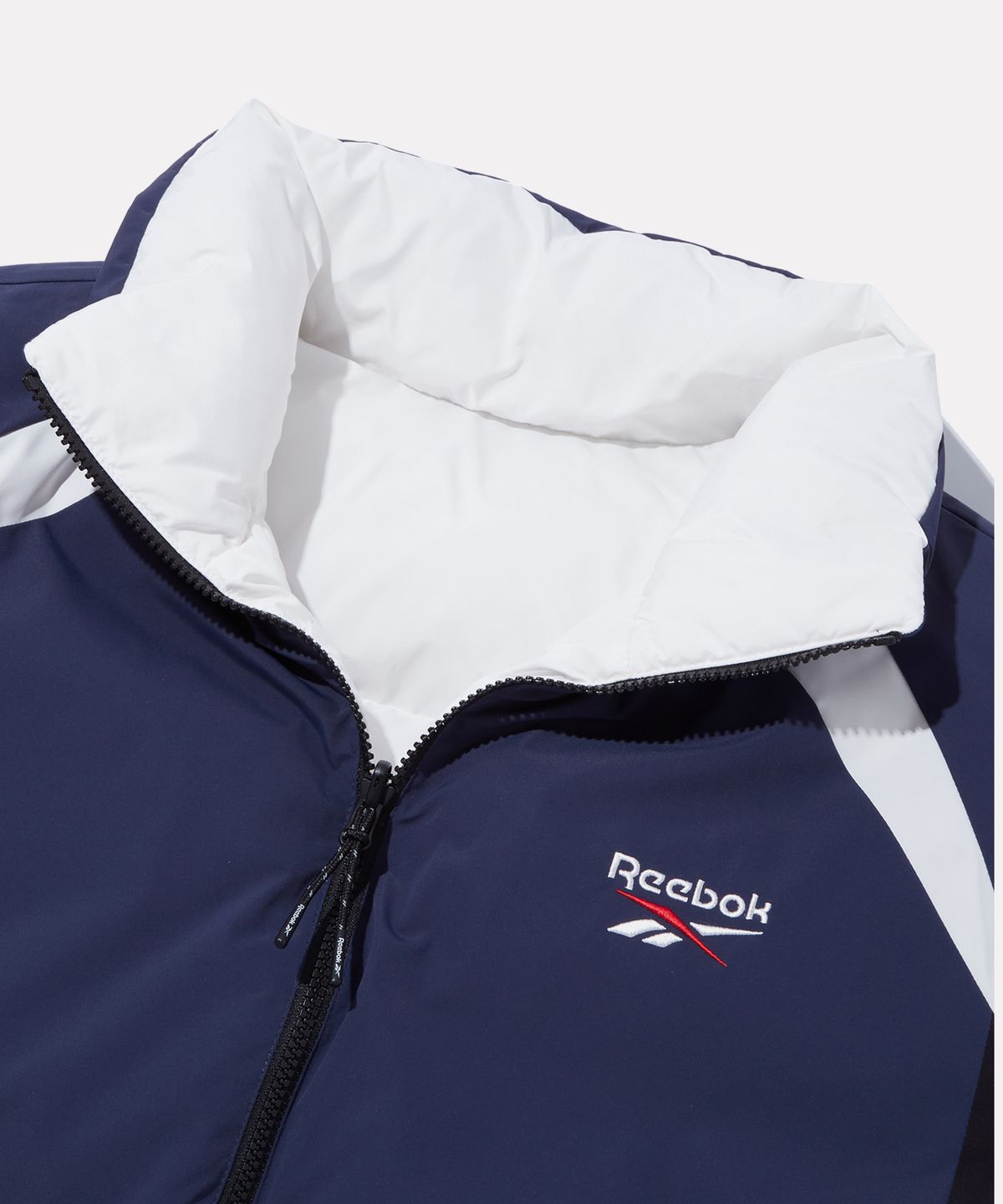 리복(REEBOK) 벡터 리버시블 볼패딩 - 네이비:화이트