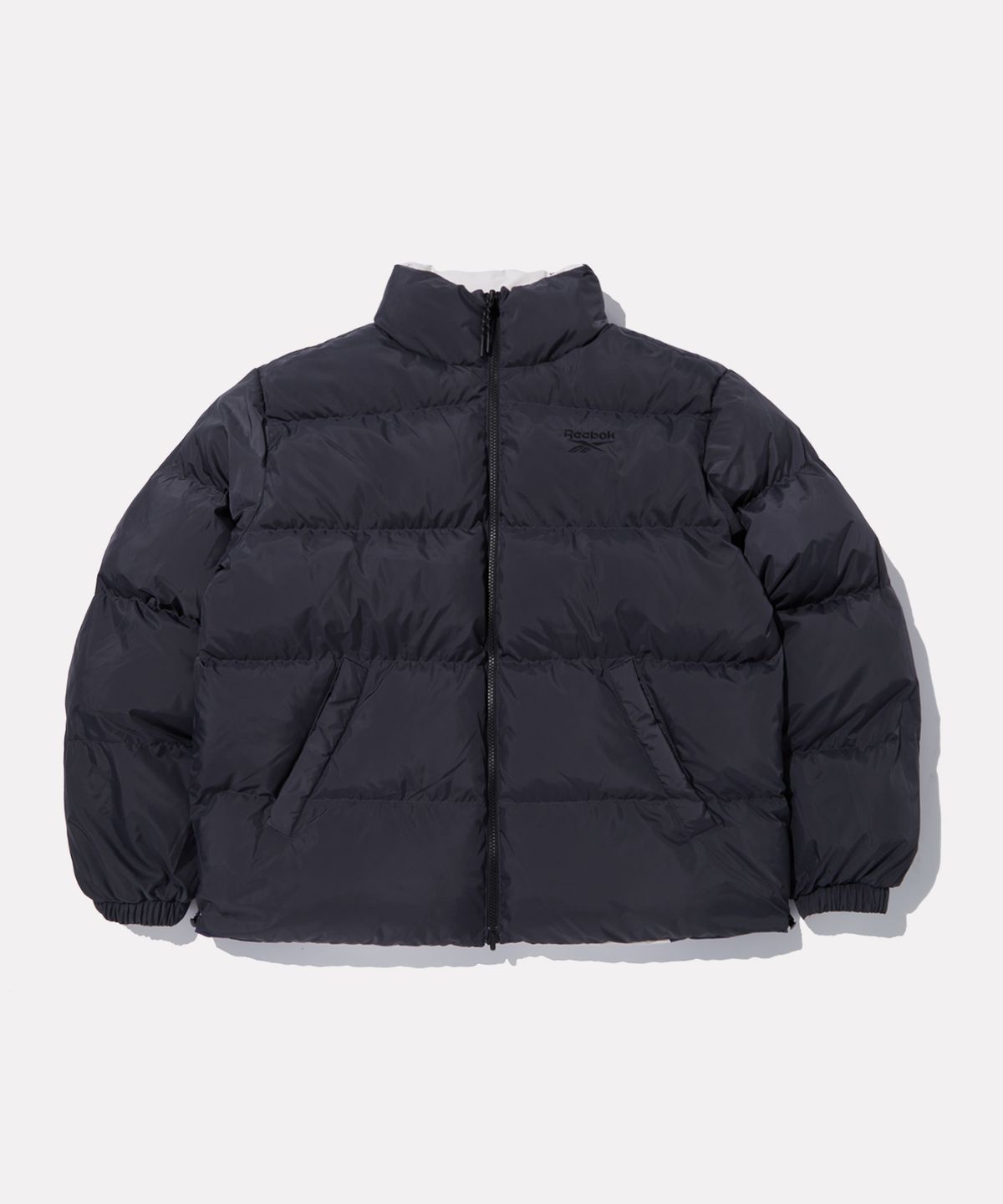 리복(REEBOK) 벡터 리버시블 볼패딩 - 페일베이지:차콜