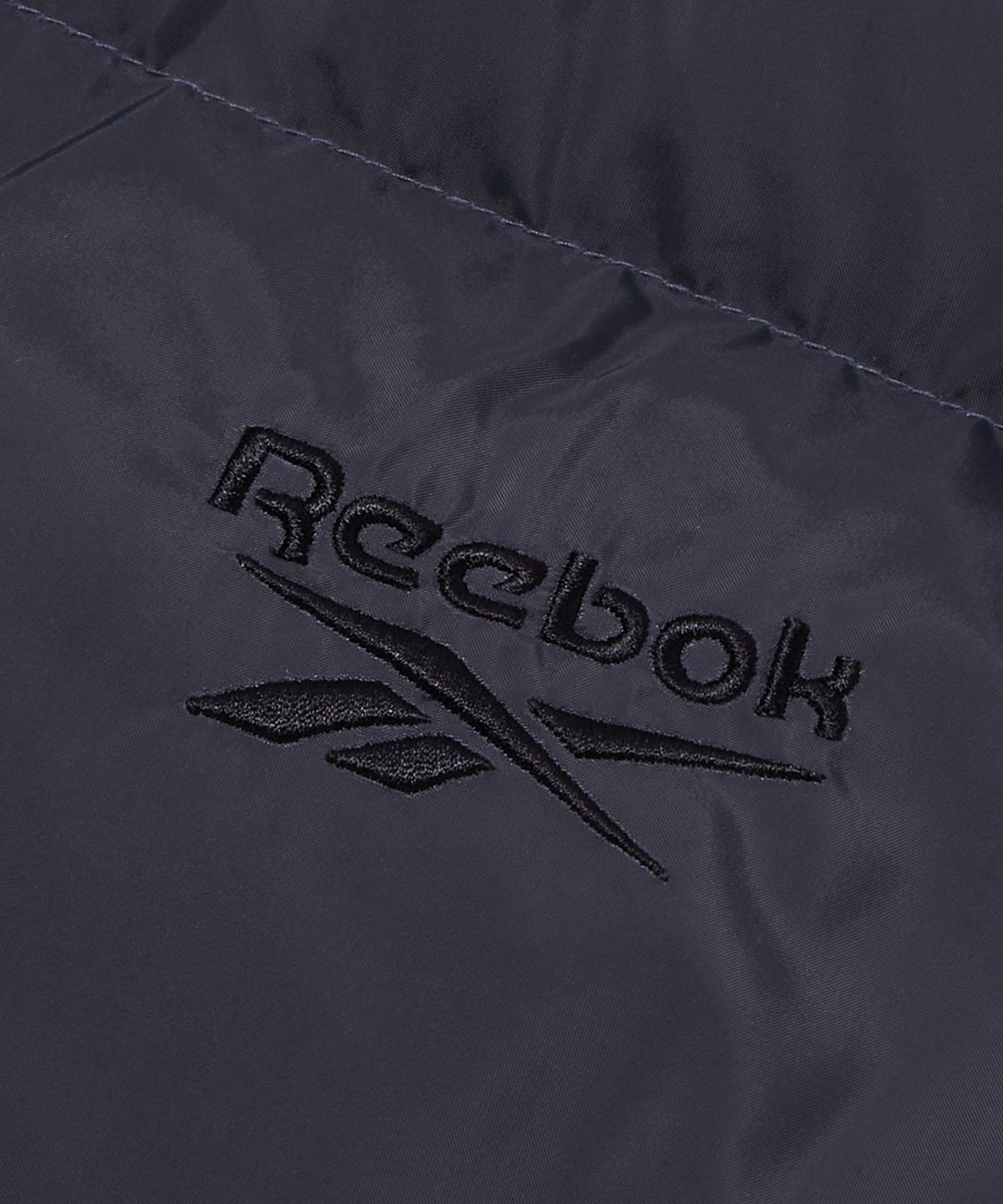 리복(REEBOK) 벡터 리버시블 볼패딩 - 페일베이지:차콜