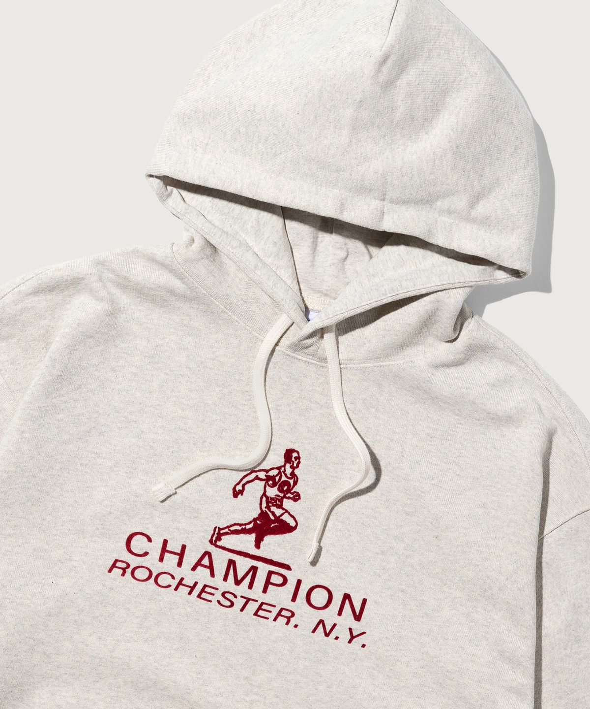 챔피온(CHAMPION) 그래픽 로고 루즈핏 후드 티셔츠 Oatmeal