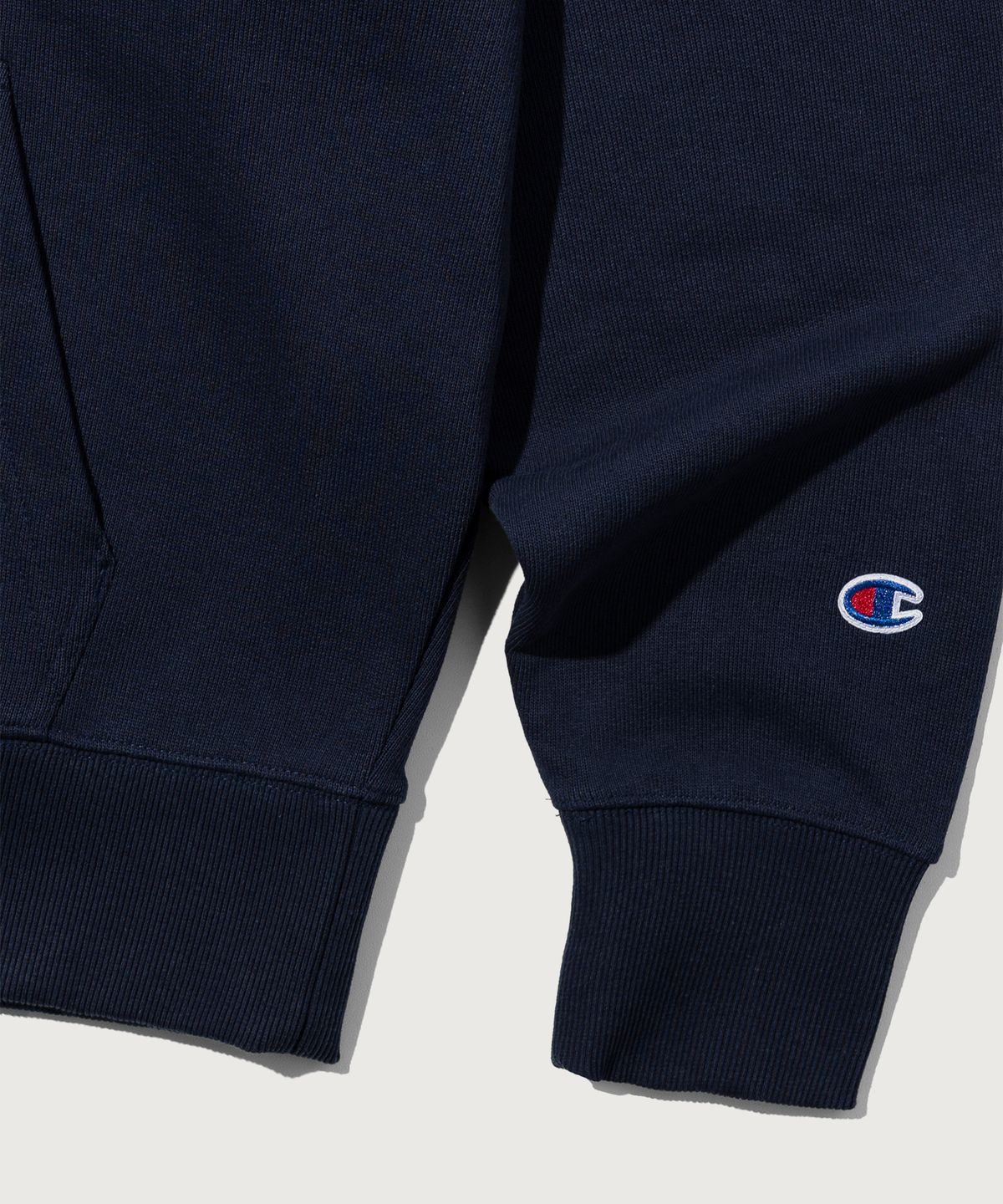 챔피온(CHAMPION) 그래픽 로고 루즈핏 후드 티셔츠 Navy