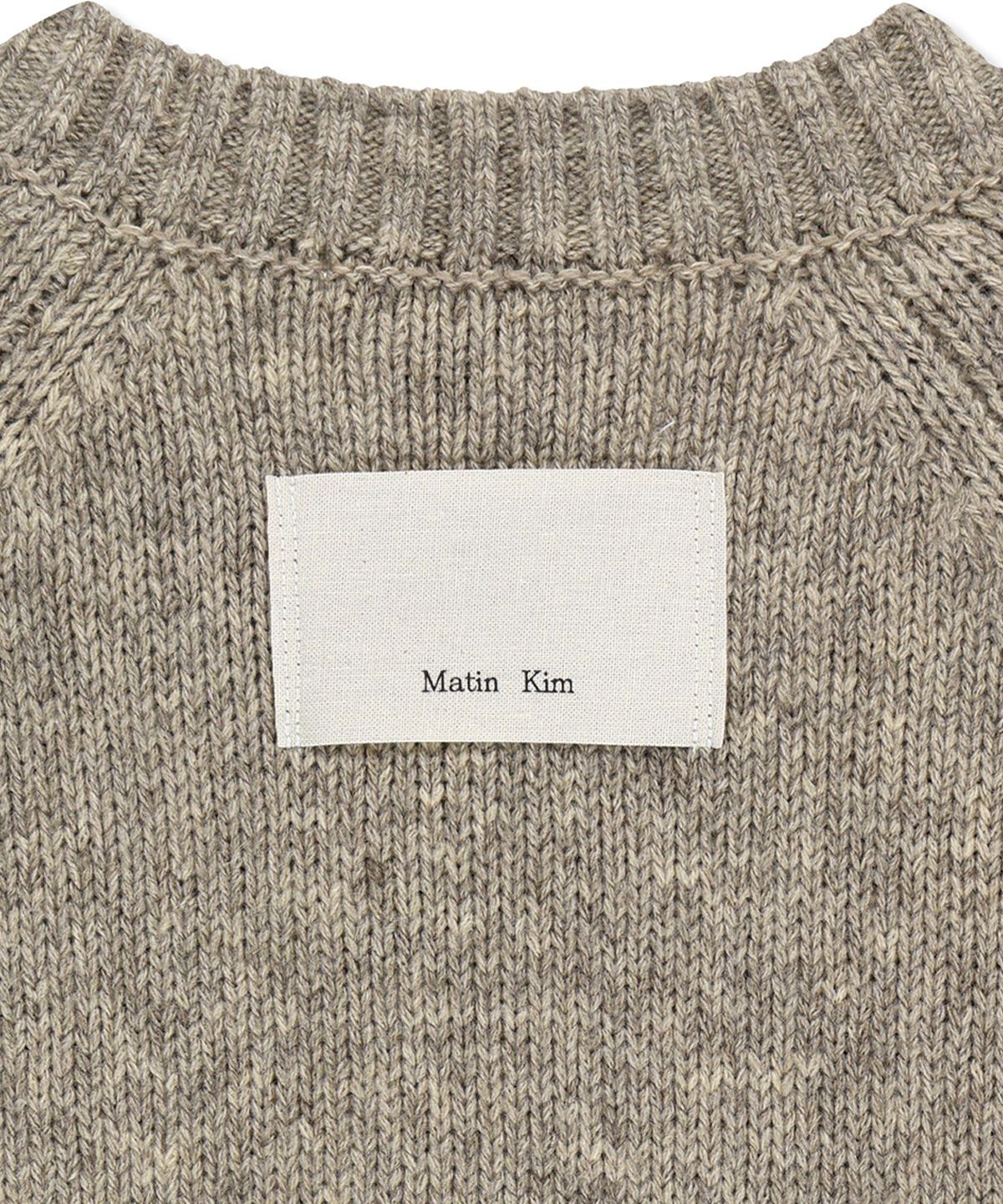 마뗑킴(MATIN KIM) MATIN BUTTON POINT HENLEY NECK LOGO KNIT TOP IN BEIGE