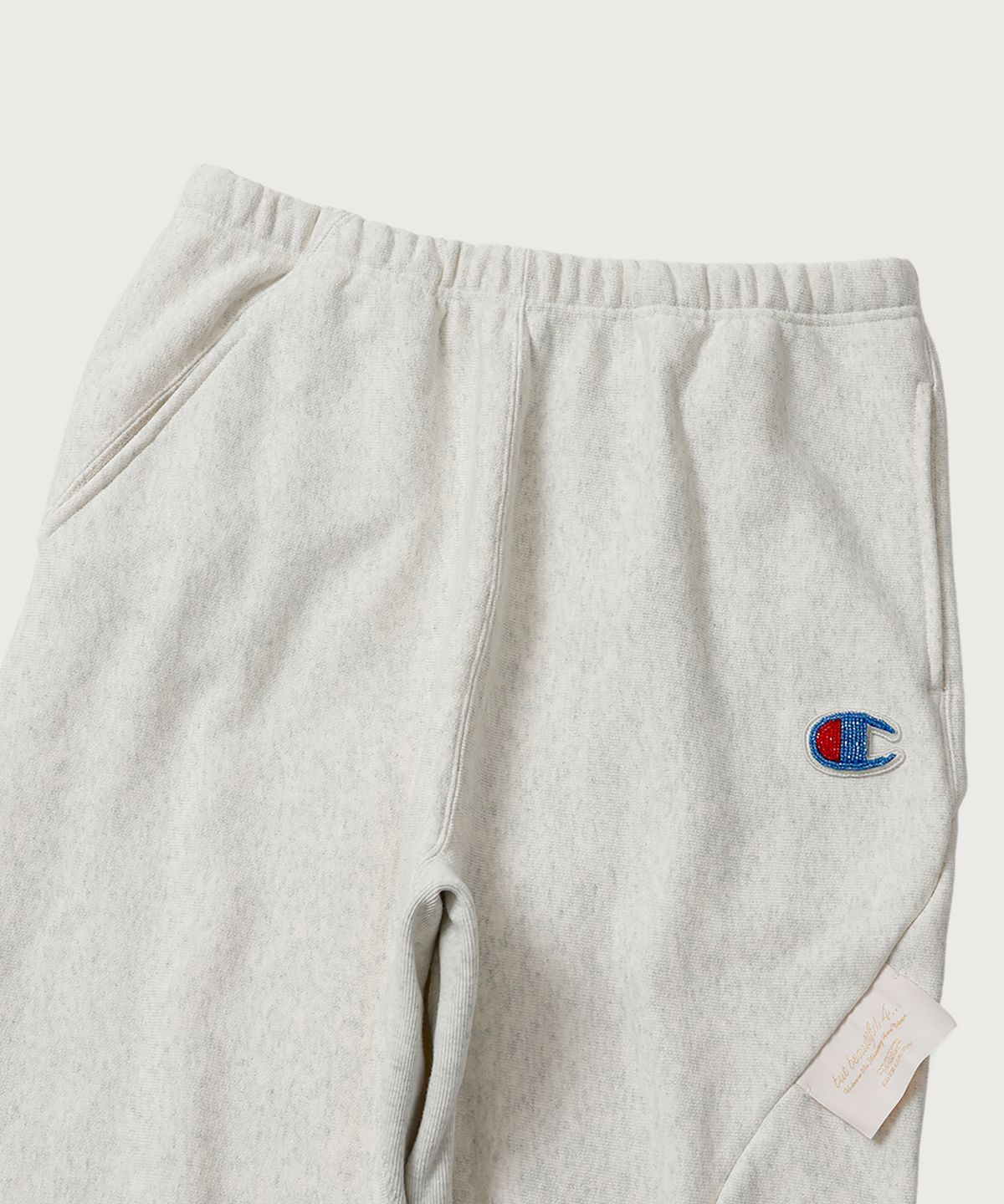 챔피온(CHAMPION) 챔피온 X 언더커버 리버스위브 스트럭처드 스웨트 팬츠 Oatmeal