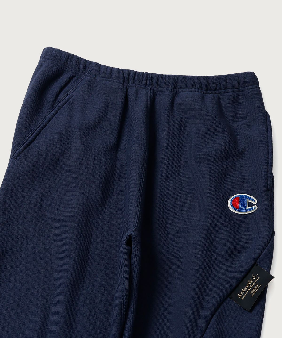 챔피온(CHAMPION) 챔피온 X 언더커버 리버스위브 스트럭처드 스웨트 팬츠 Dark Navy