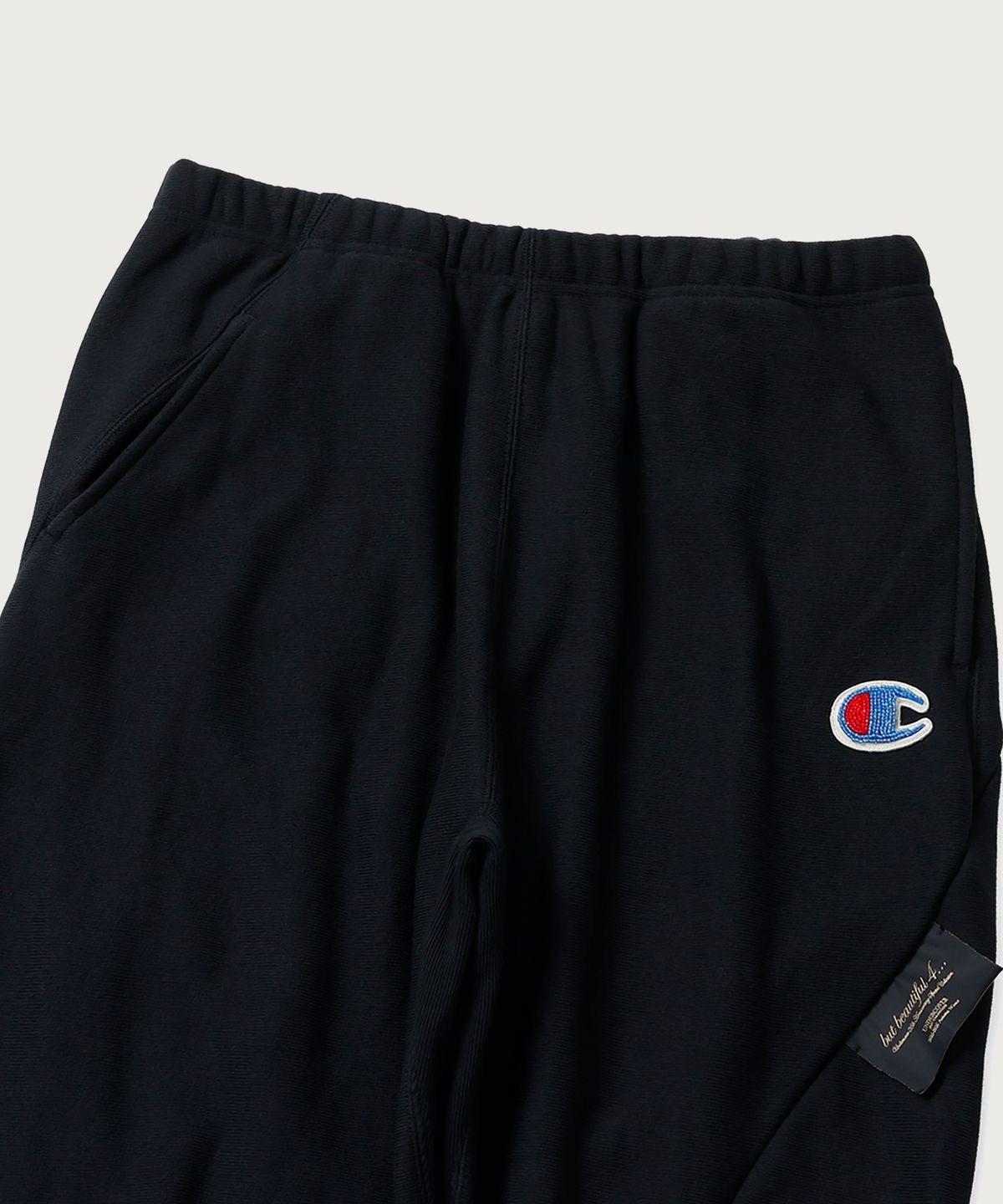 챔피온(CHAMPION) 챔피온 X 언더커버 리버스위브 스트럭처드 스웨트 팬츠 Black