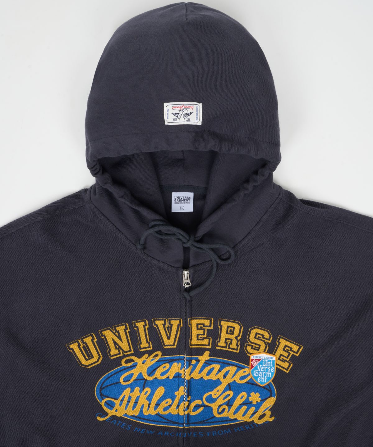 유니버스 가먼트(UNIVERSE GARMENT) 유니버스 싸인 리버스 후드 집업_Charcoal