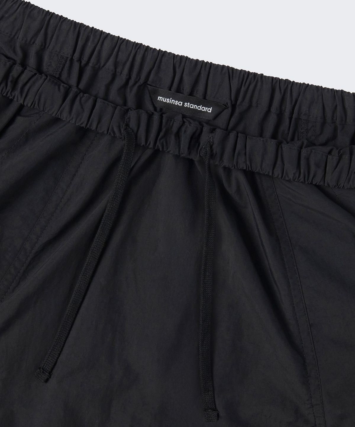 무신사 스탠다드 우먼(MUSINSA STANDARD WOMAN) 우먼즈 나일론 루치드 롱 스커트 [블랙]