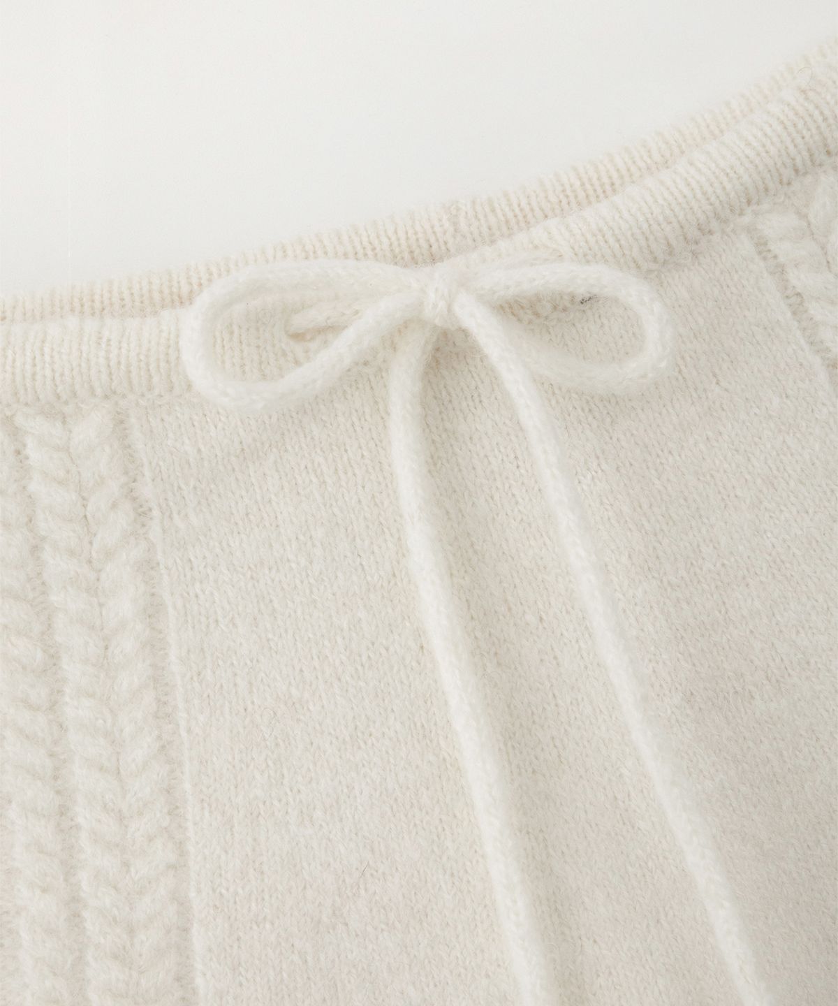 썸웨어버터(SOMEWHEREBUTTER) Alpaca Cable Mini Skirt - Ivory