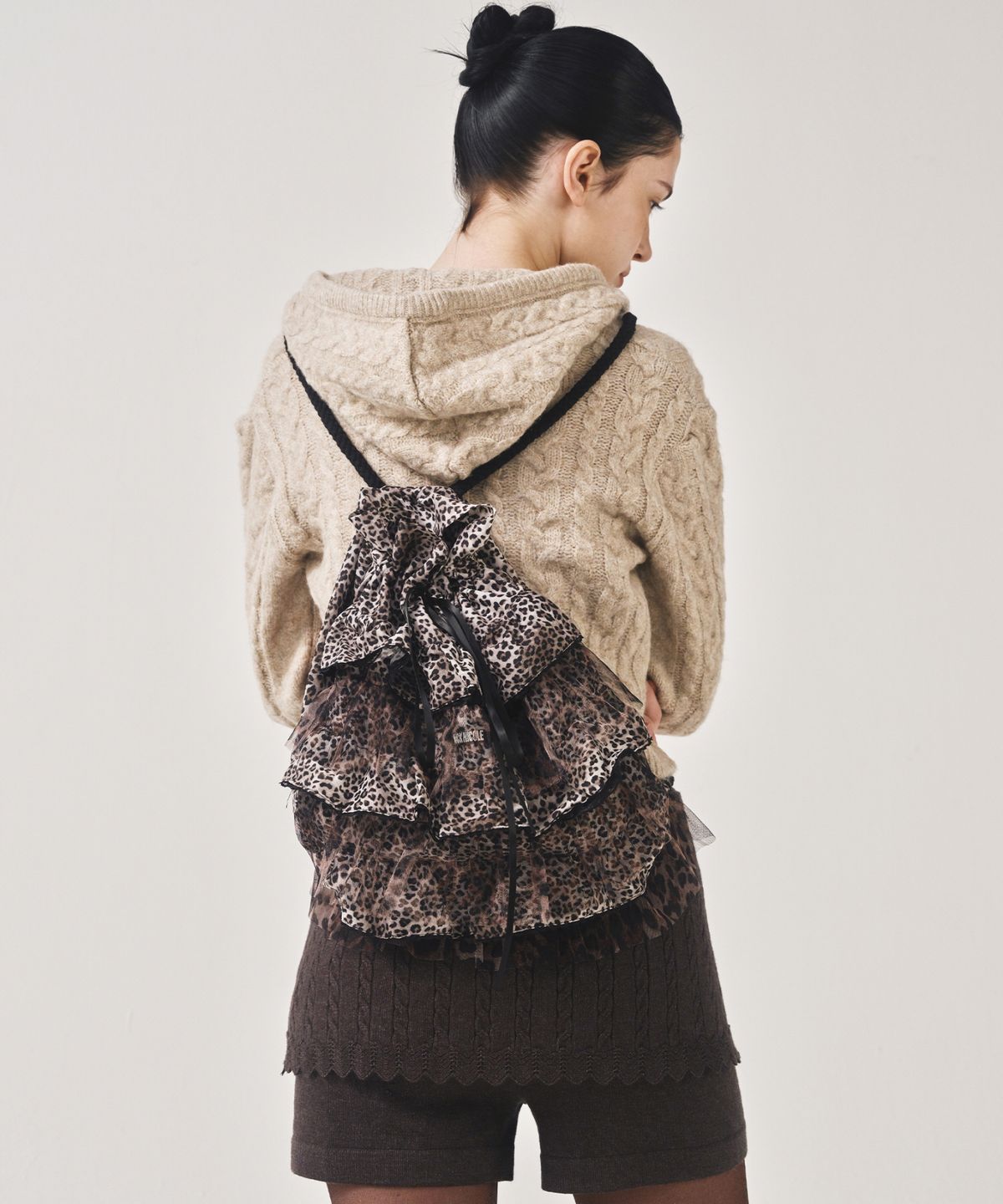 닉앤니콜(NICK&NICOLE) LEOPARD LAYERED STRING BACKPACK_BROWN