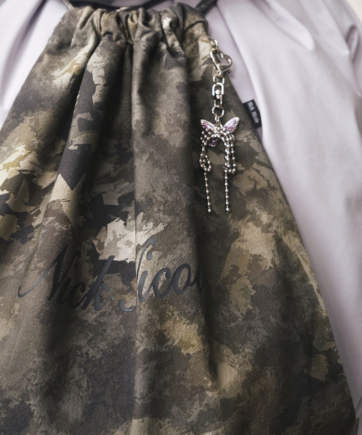 닉앤니콜(NICK&NICOLE) NICOLE CAMO STRING BACKPACK_DEEP GREEN