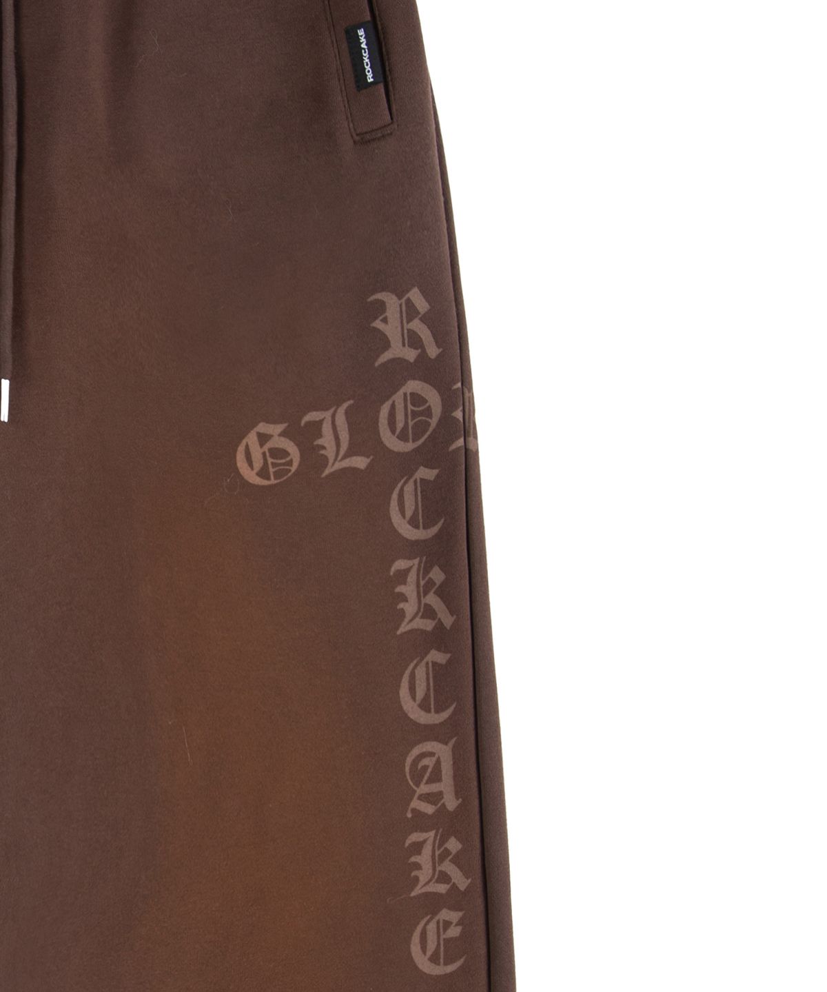 락케이크(ROCKCAKE) Washed Cross Lettering 2way Jogger - Brown