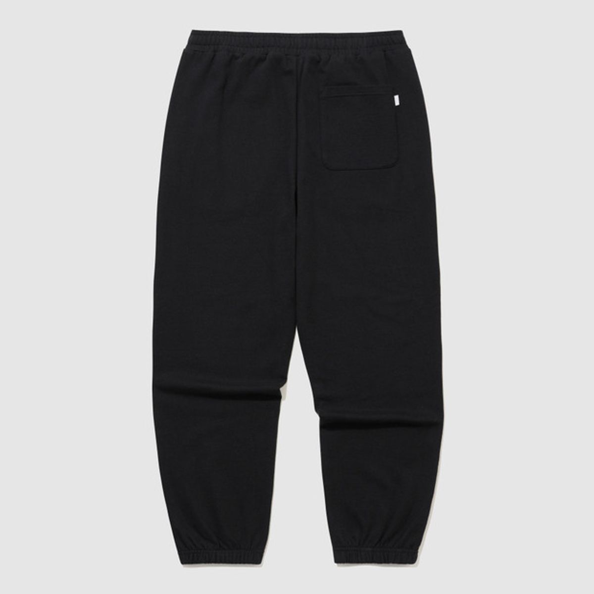 엄브로(UMBRO) 에센셜 루즈 조거 팬츠 블랙 UR123CFP19