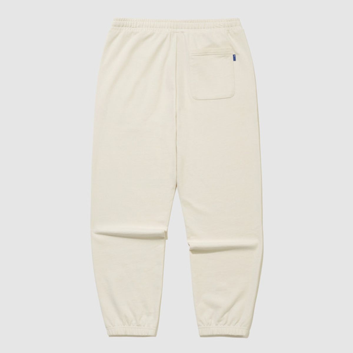 엄브로(UMBRO) 에센셜 루즈 조거 팬츠 아이보리 UR123CFP19
