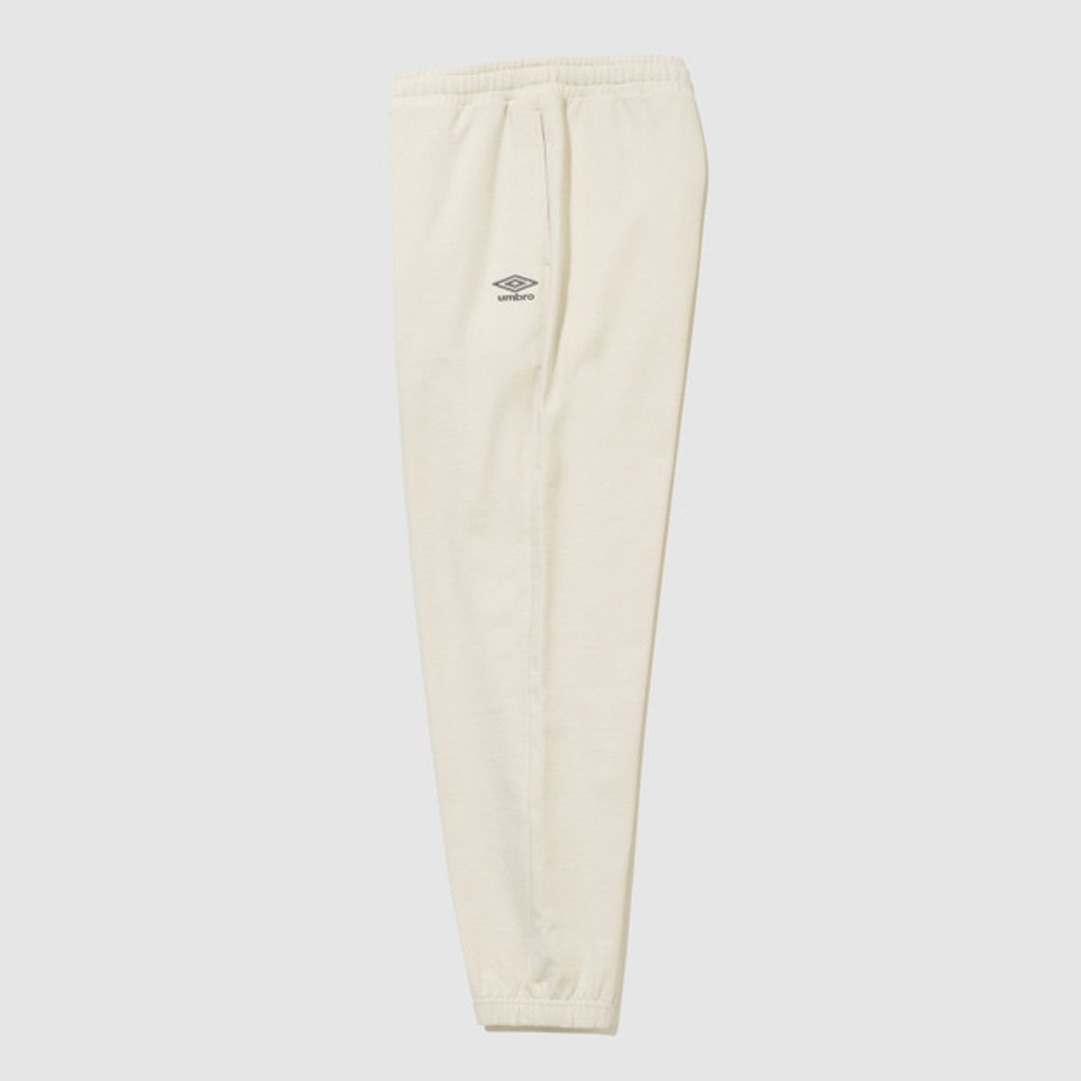 엄브로(UMBRO) 에센셜 루즈 조거 팬츠 아이보리 UR123CFP19