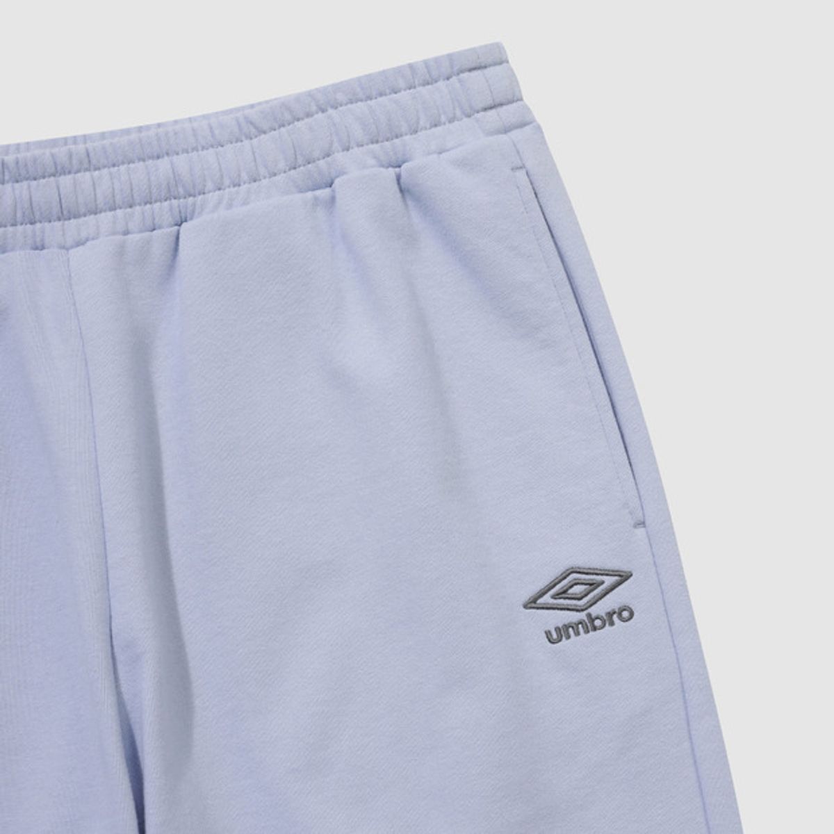 엄브로(UMBRO) 에센셜 루즈 조거 팬츠 스카이블루 UR123CFP19