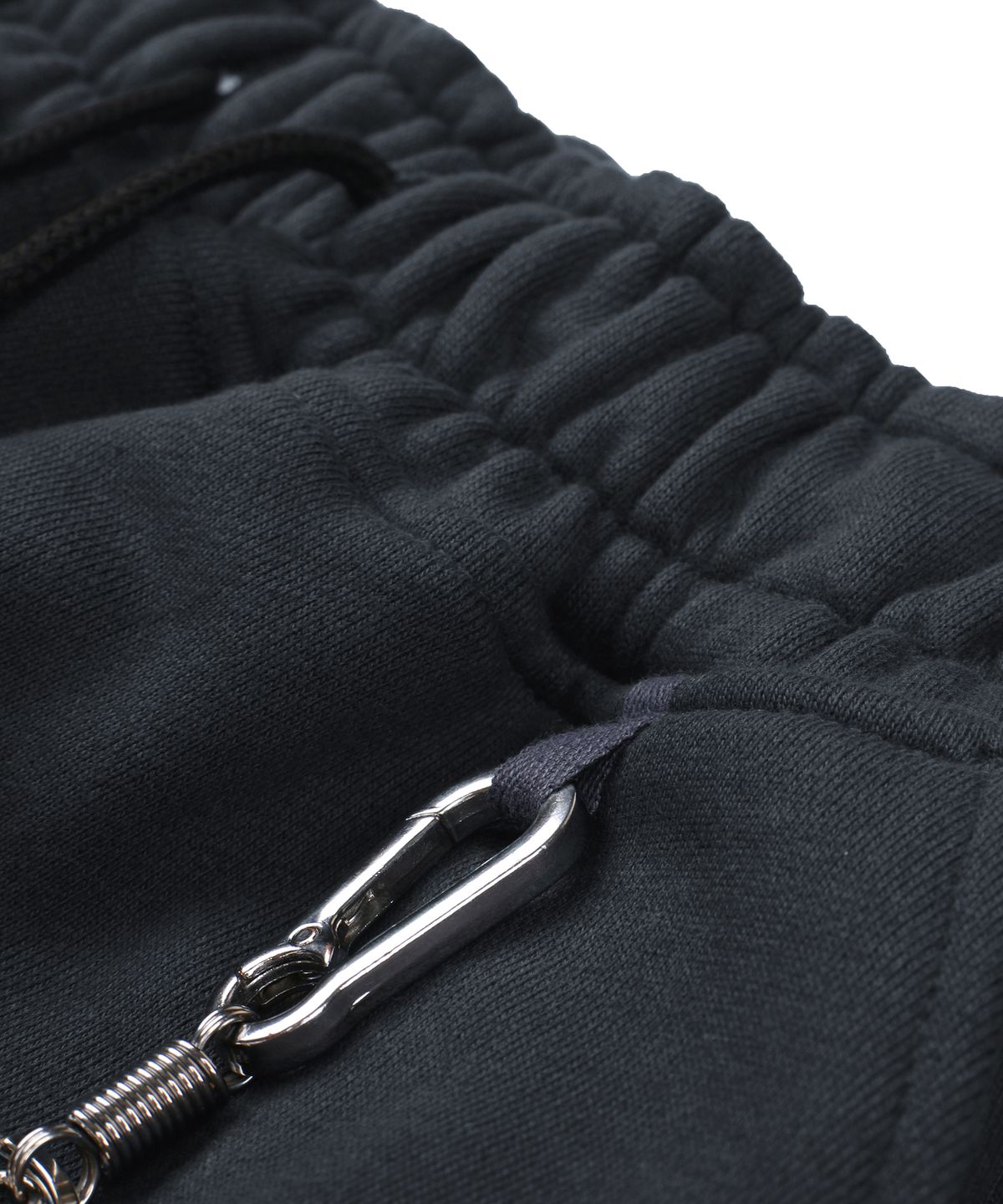 언노운컴노멀(UNKNOWNCOMENORMAL) Symbol Crystal Sweat Pants [CHARCOAL]