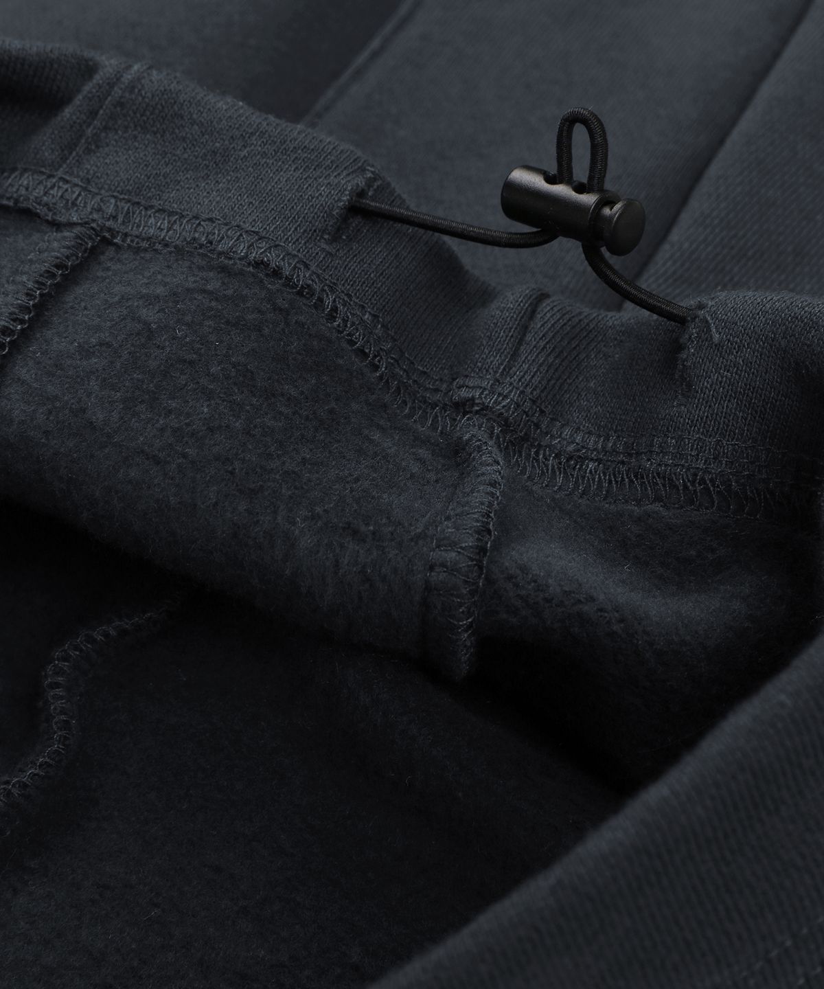 언노운컴노멀(UNKNOWNCOMENORMAL) Symbol Crystal Sweat Pants [CHARCOAL]