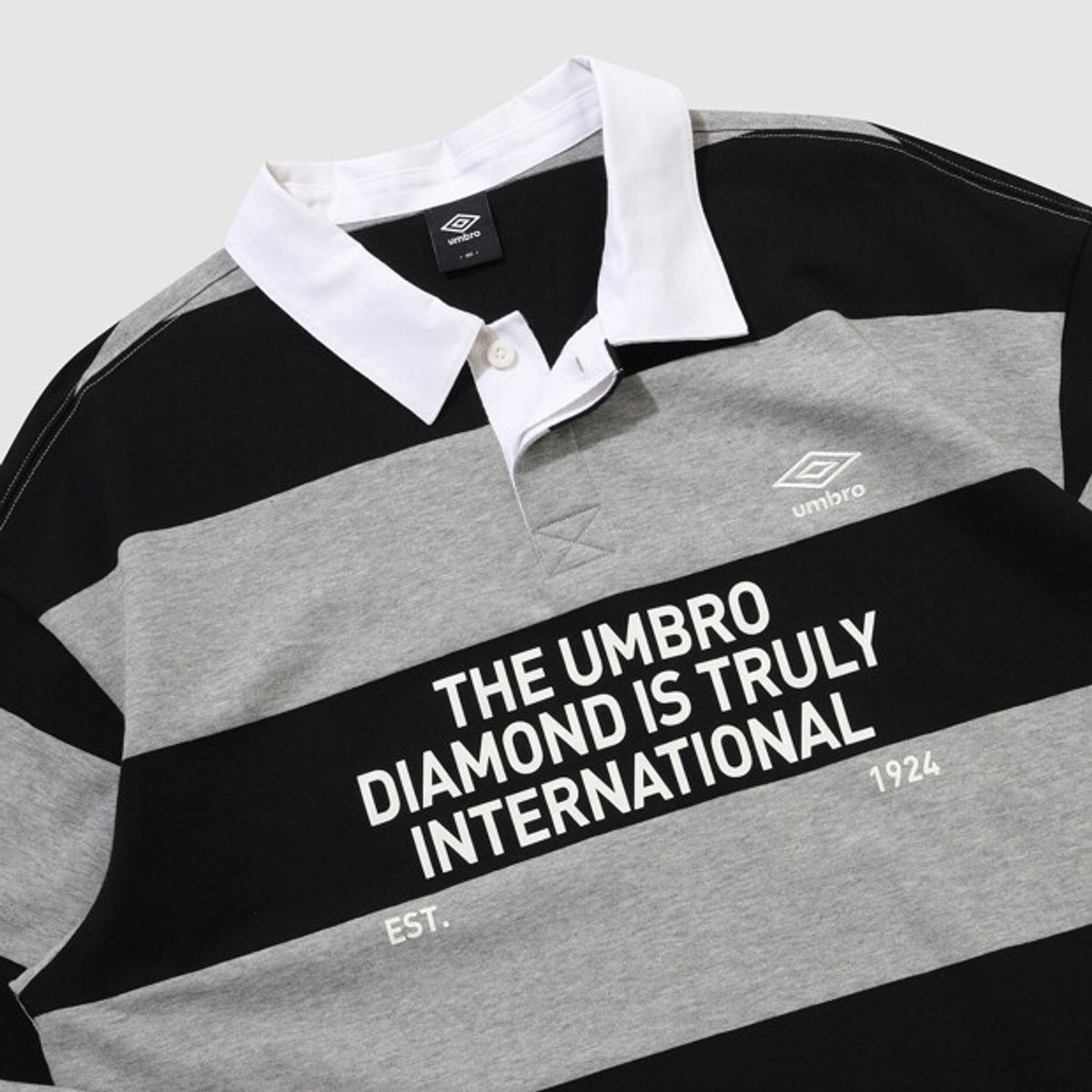 엄브로(UMBRO) 스트라이프 럭비 티셔츠 블랙 UR121CTL11