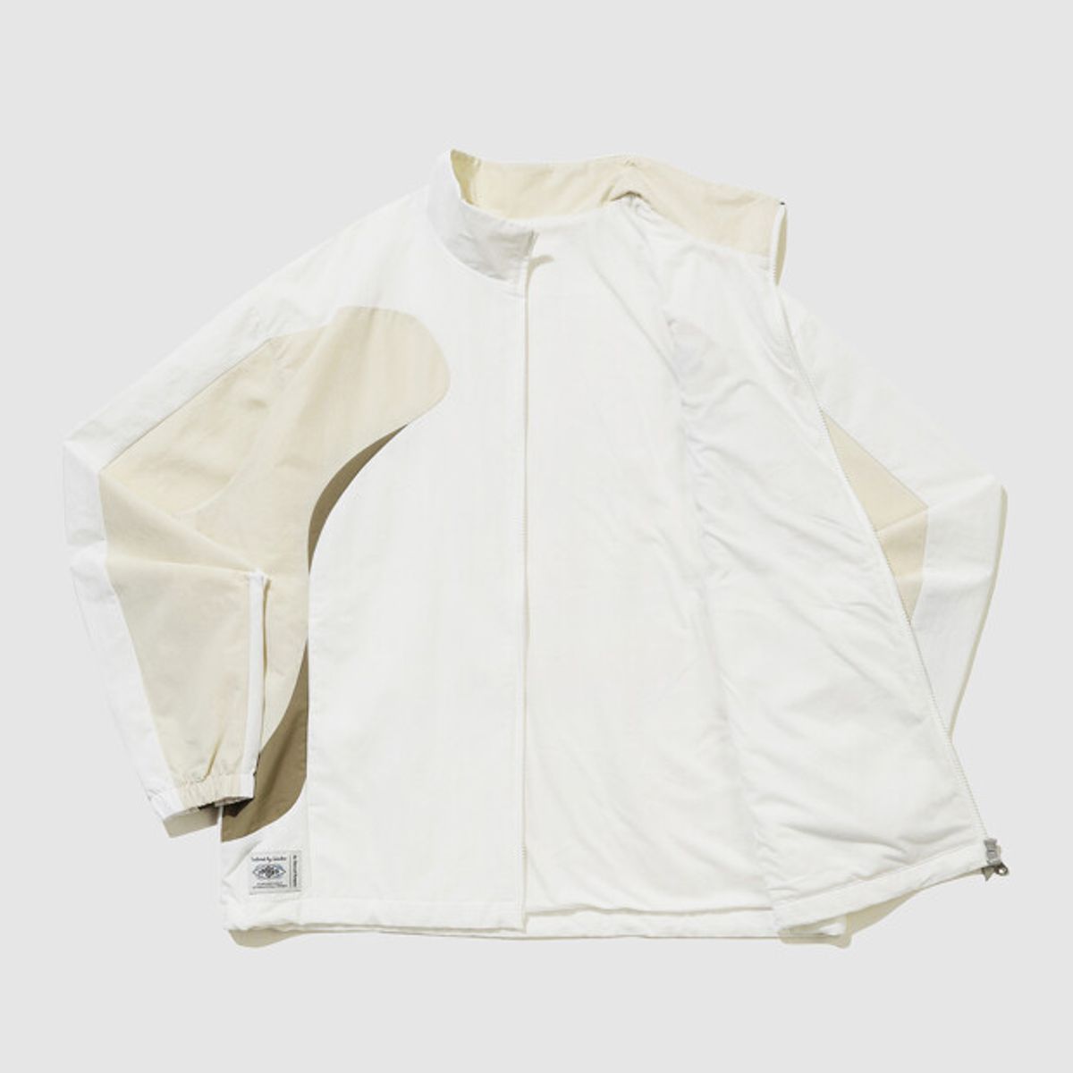 엄브로(UMBRO) HBL 브릿 캐주얼 스탠넥 바람막이 자켓 아이보리 UR121CJK24